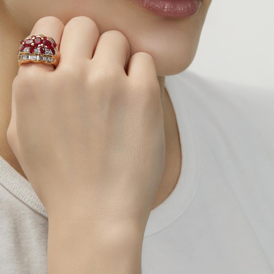Make a statement with the exquisite Oval Marquise Ruby and Diamond Dome Ring. Crafted from luxurious 18-karat yellow gold, this ring boasts a timeless elegance.

The centerpiece of the ring features a stunning 3.23-carat marquise-cut ruby, exuding a