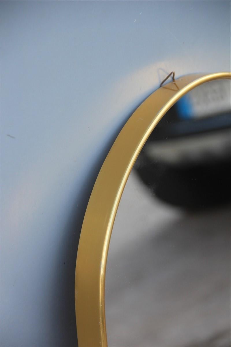 Oval midcentury Italian wall mirror aluminum golden 1950s Italian design.