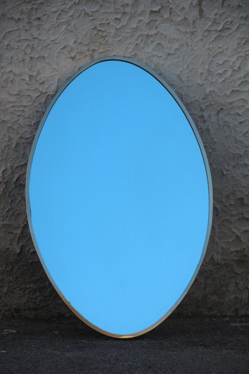 Oval Mid-Century Modern wall mirror Italian design 1950s brass edge gold.