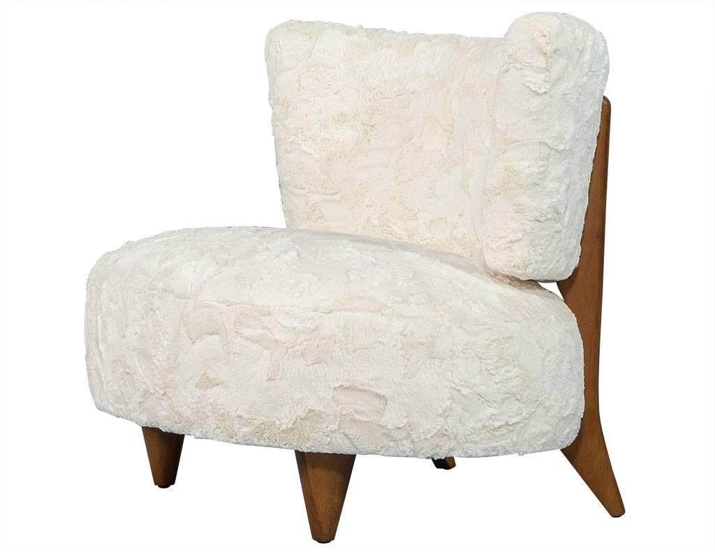 Heaven sent oval midcentury Cloud chair. This cloud like chair packs a powerful punch. The gesture of the wide silhouette provides comfort, while the simplicity projects enough posh for a formal parlor. And the elegant fur finishes off the