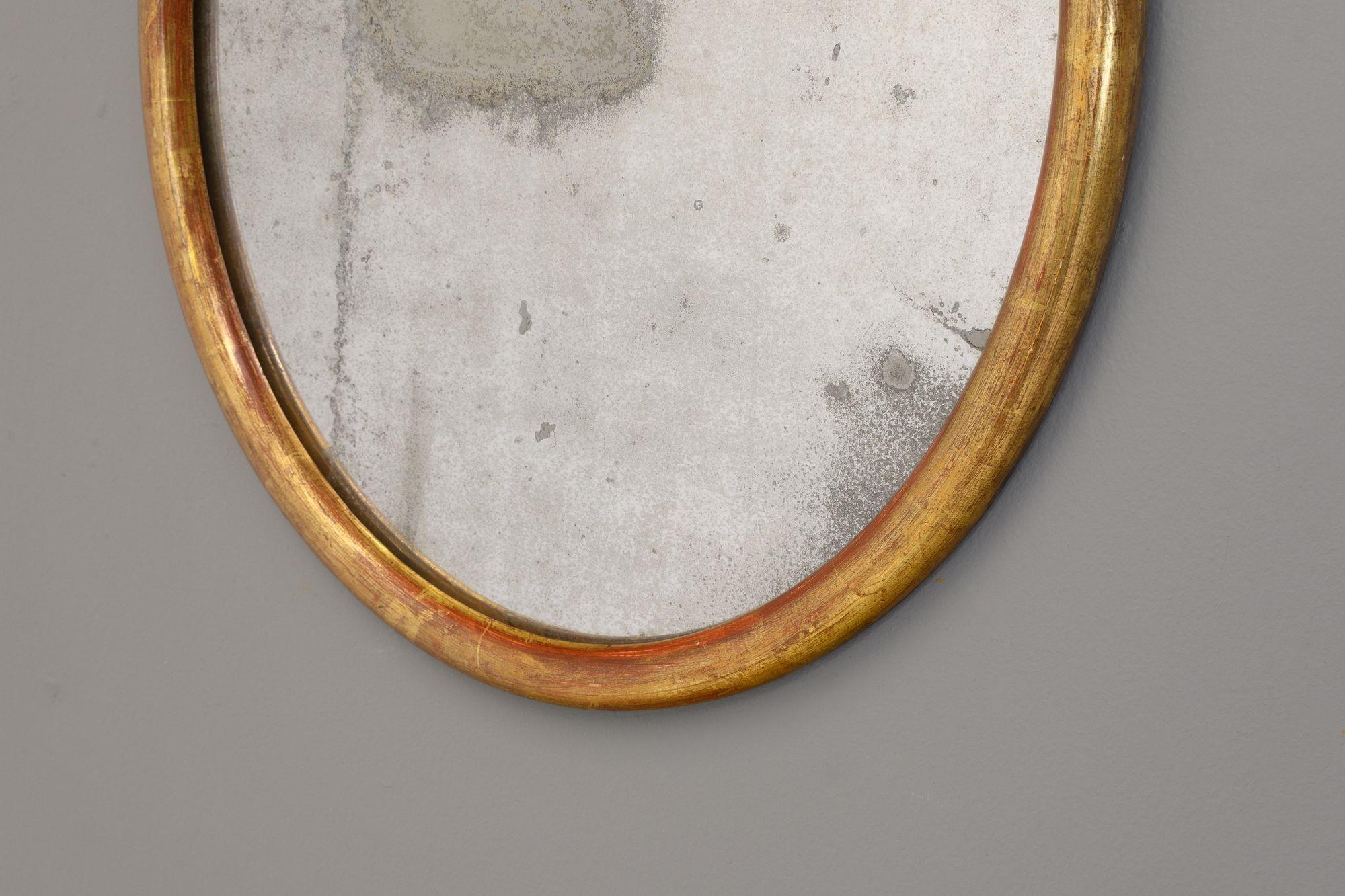 Oval mirror with gilded, beaded frame and old mirror glass. France circa 1880.

H 49cm x W 41.5cm x D 3cm