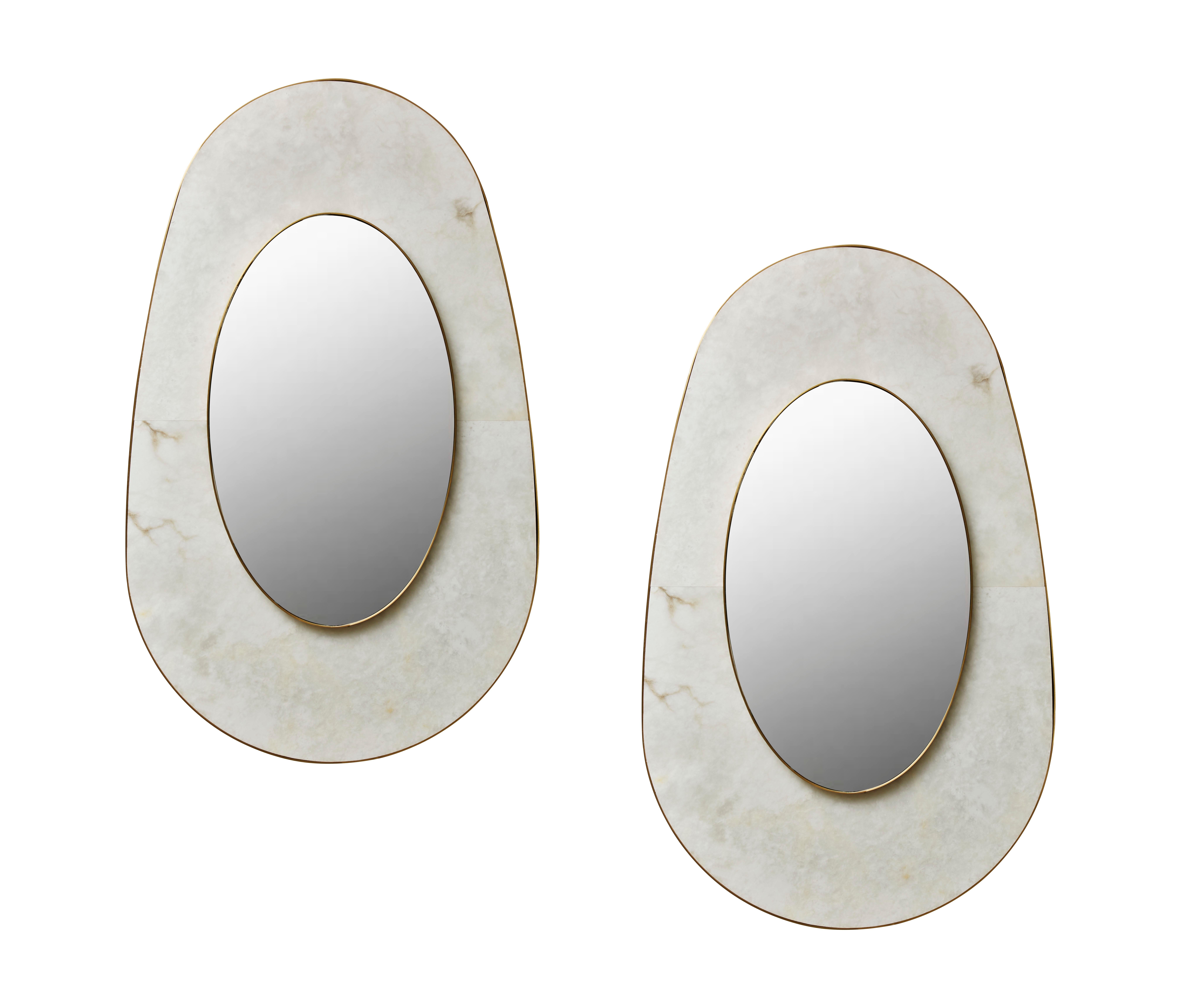 Gorgeous free-shaped mirror in alabaster and brass. Beveled mirror. 
Pair available. Creation by Studio Glustin.