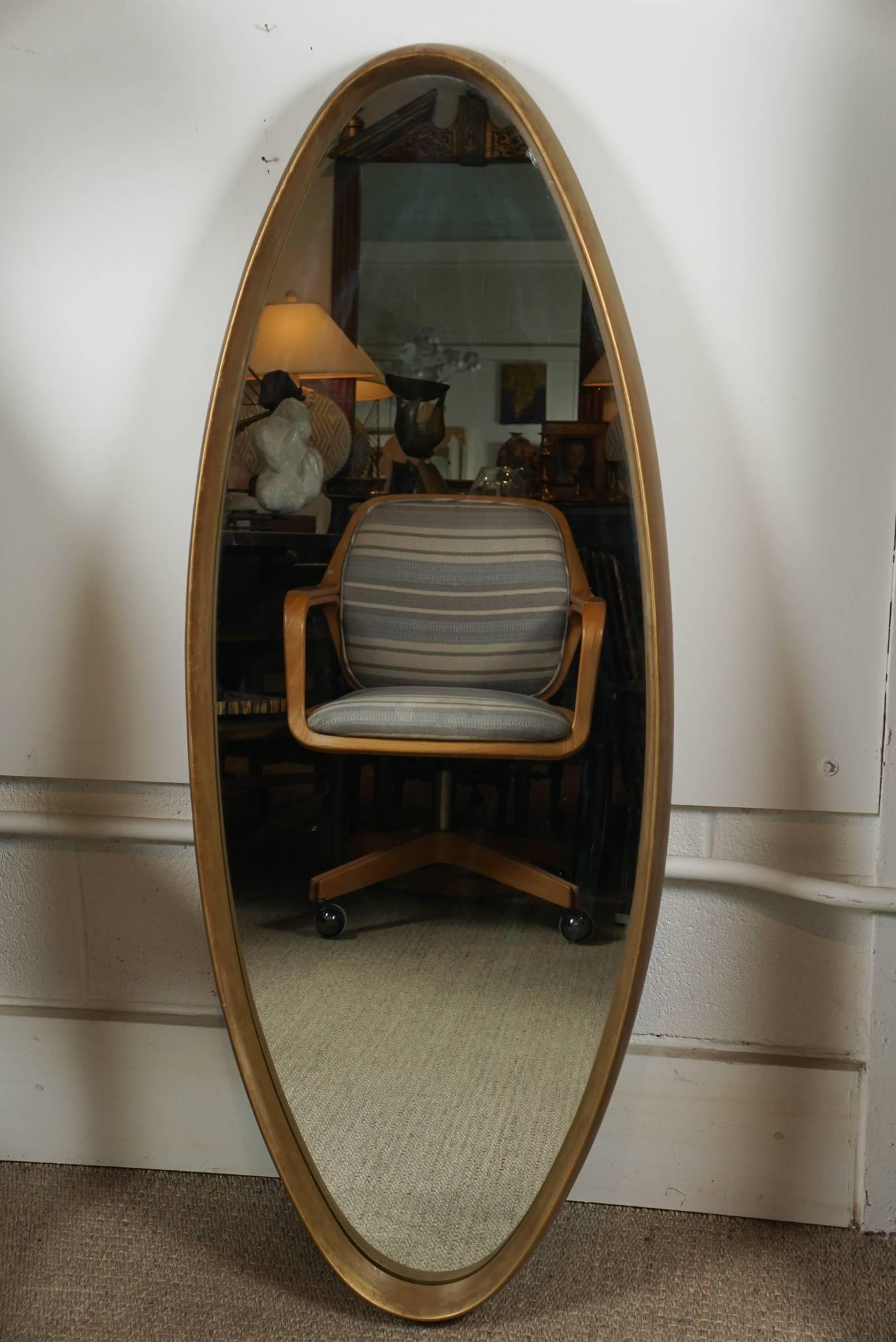 Here is a great oval mirror with a 2 inch deep inset frame in a painted gold finish.
The mirror is vintage with original painted finish and is in the style of La Barge.
There is a hard Masonite backing that is securely attached to the mirror.