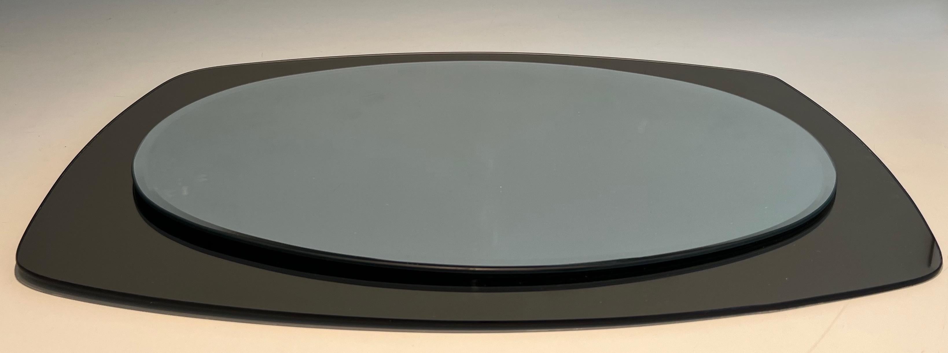 Mirror Oval mirror. Italian work by Fontana Arte. Circa 1970 For Sale