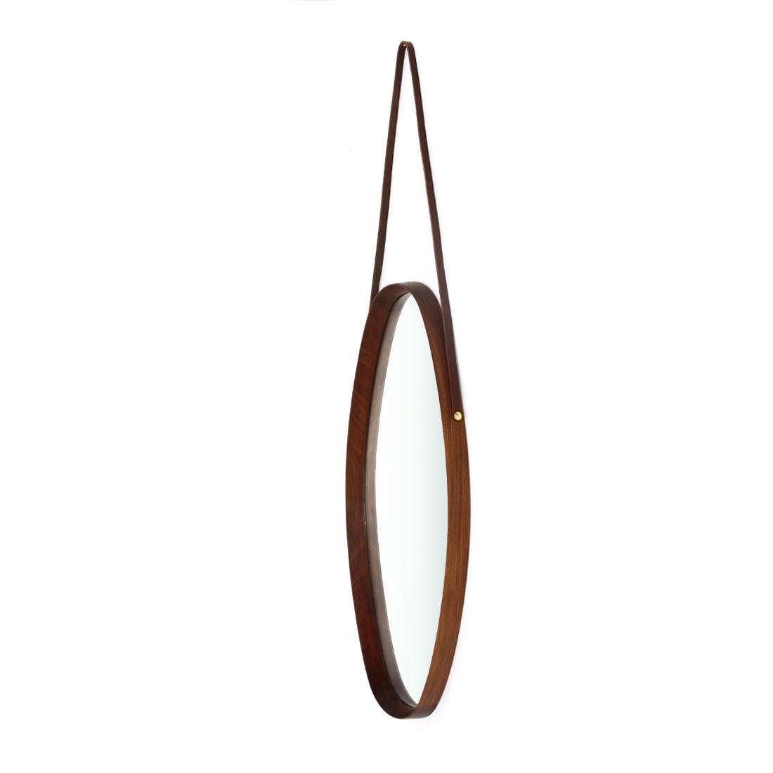 Mirror of Italian manufacture produced in the 1960s.
Oval shaped teak wood frame.
Mirrored glass surface.
Leather lace with brass studs.
Good general condition, some signs due to normal use over time.
Leather lace replaced with a new