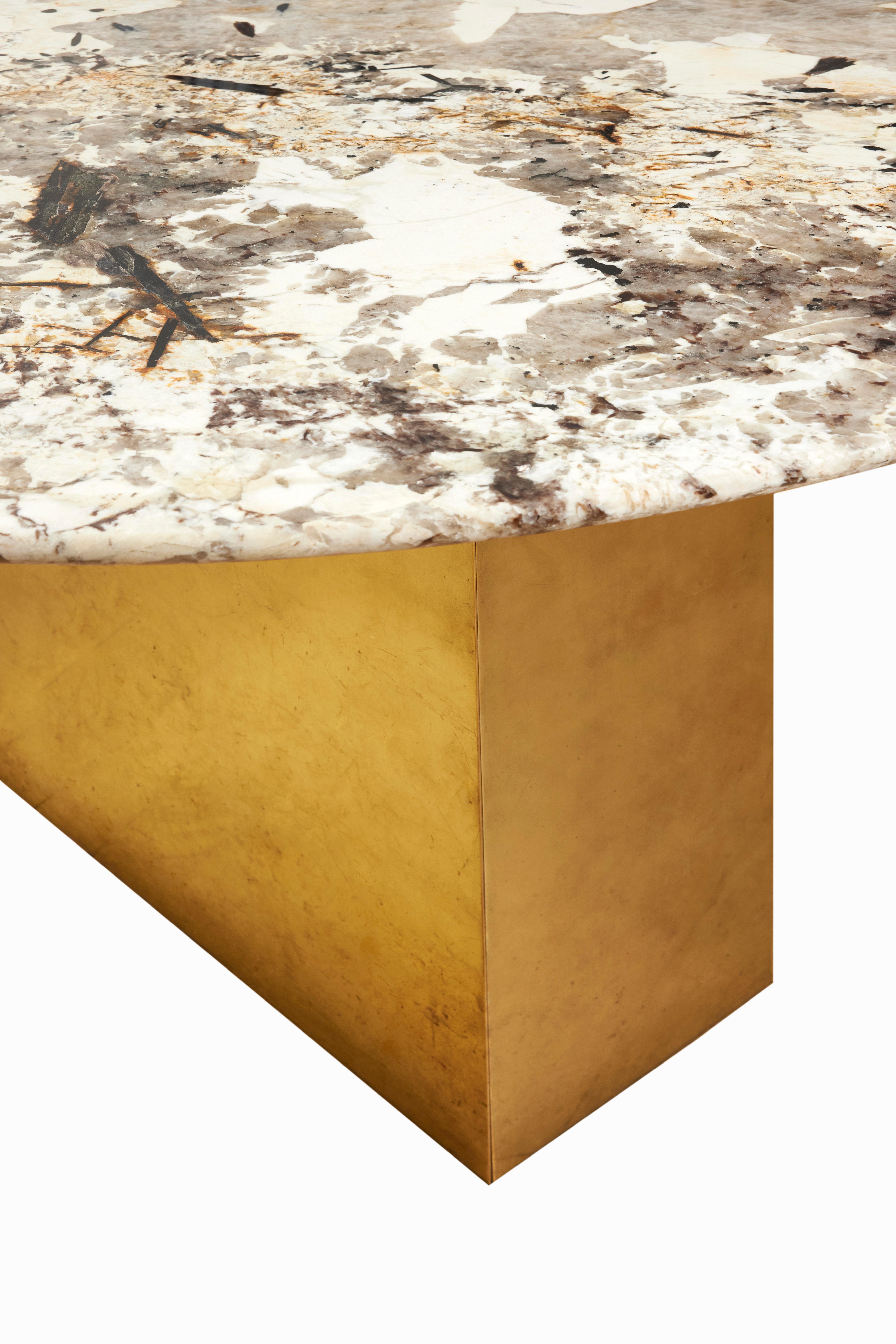 Oval breccia polished marble top mounted on 3 brass plated monoliths bases, brass grommet on the middle of the top.
Made In France.