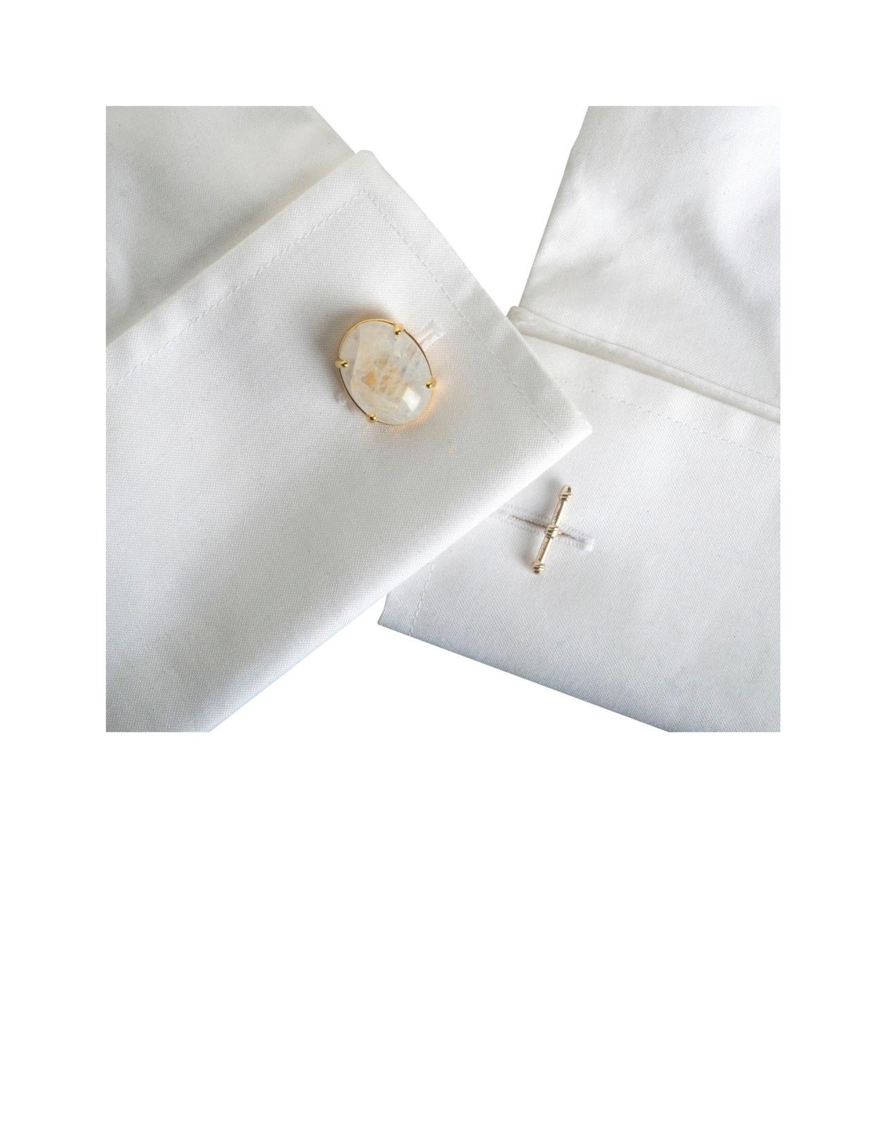 These striking cufflinks, designed to be worn with a French cuff shirt by either a man or a woman, are shown set in 14K yellow gold and feature a chain and solid gold T-bar.  The T-bar is a signature Dudley VanDyke design.  The luminous and fiery