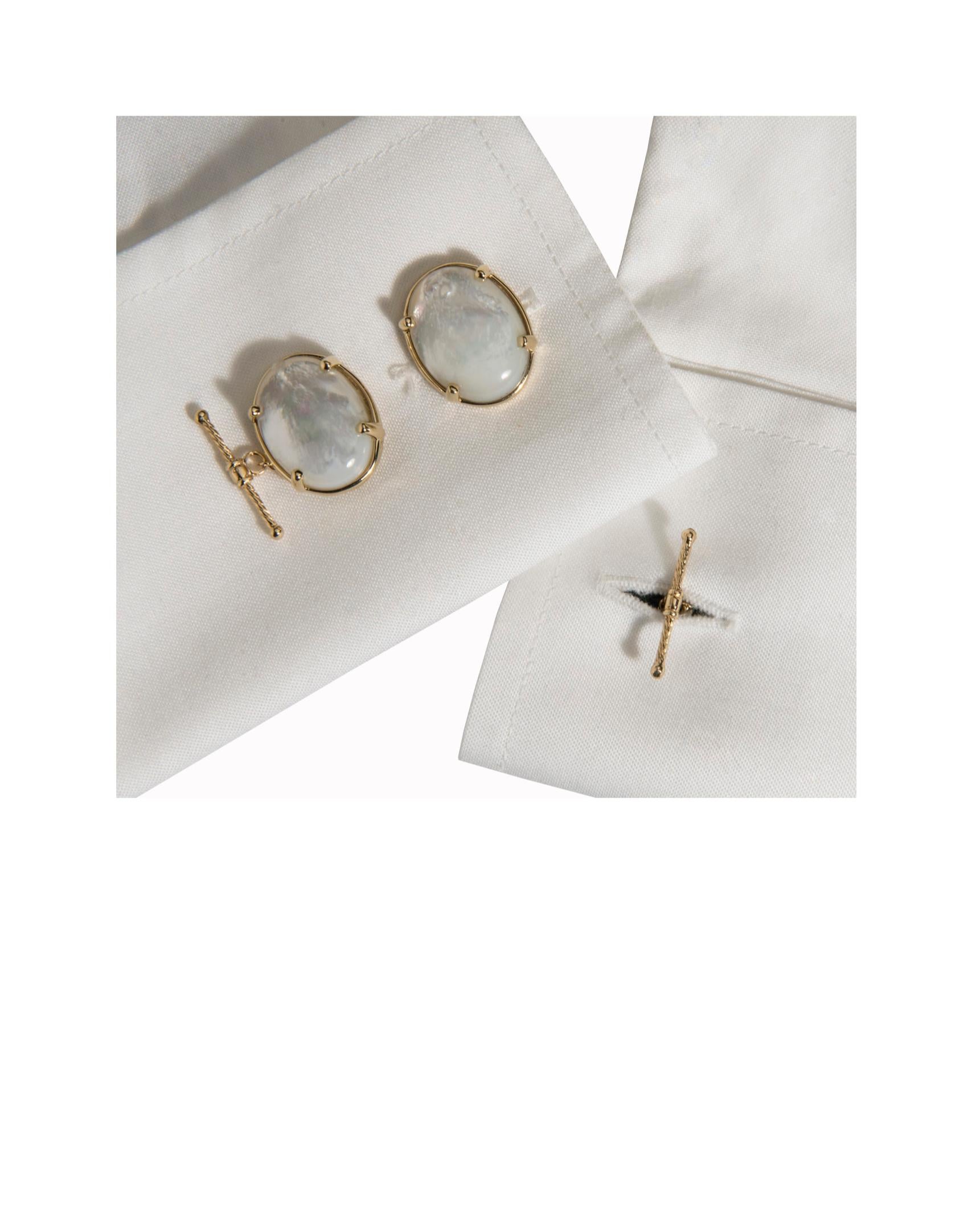 These striking cufflinks, designed to be worn with a French cuff shirt by either a man or a woman, are shown set in 14K yellow gold and feature a chain and solid gold T-bar.  The T-bar is a signature Dudley VanDyke design.  The luminous Mother of