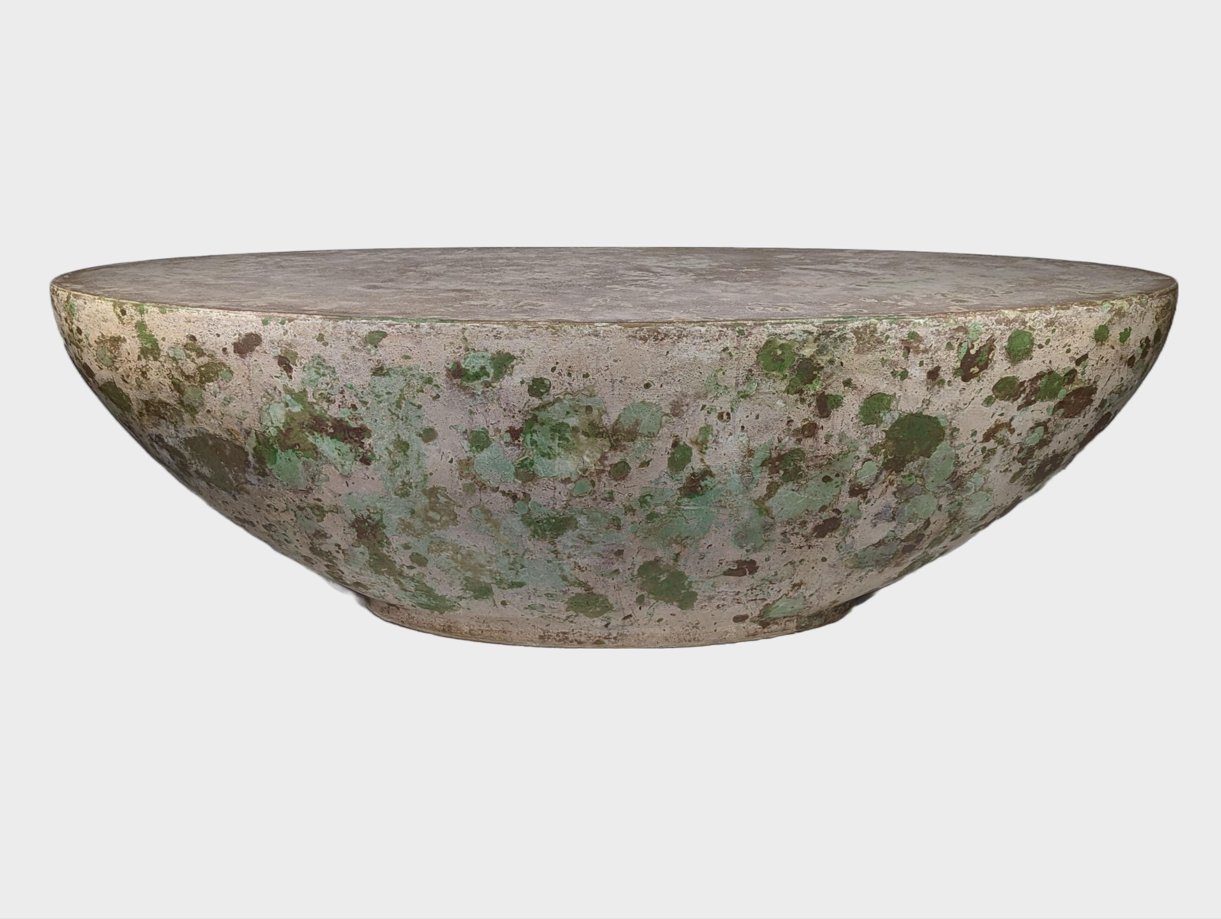 Meander past this moss and lichen-inspired, contemporary concrete coffee table. It's calming oval form is kind to knees and hands alike. Approximately 21