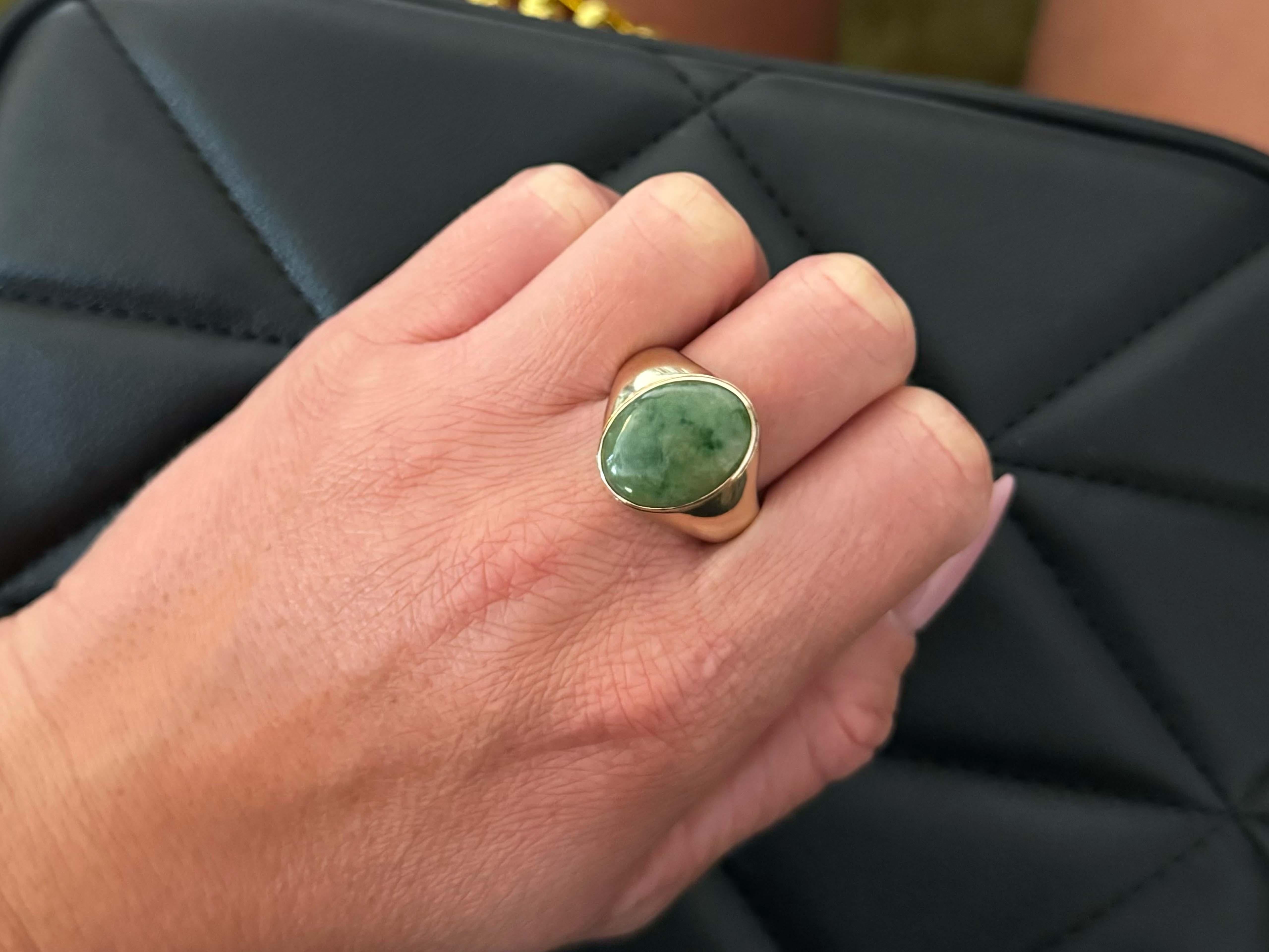 Item Specifications:

Metal: 14k Yellow Gold 

Style: Statement Ring

Ring Size: 10.5 (resizing available for a fee)

Total Weight: 10.0 Grams

Gemstone Specifications:

Center Gemstone: Jadeite Jade

Shape: Oval

Color: Mottled Green

Jade