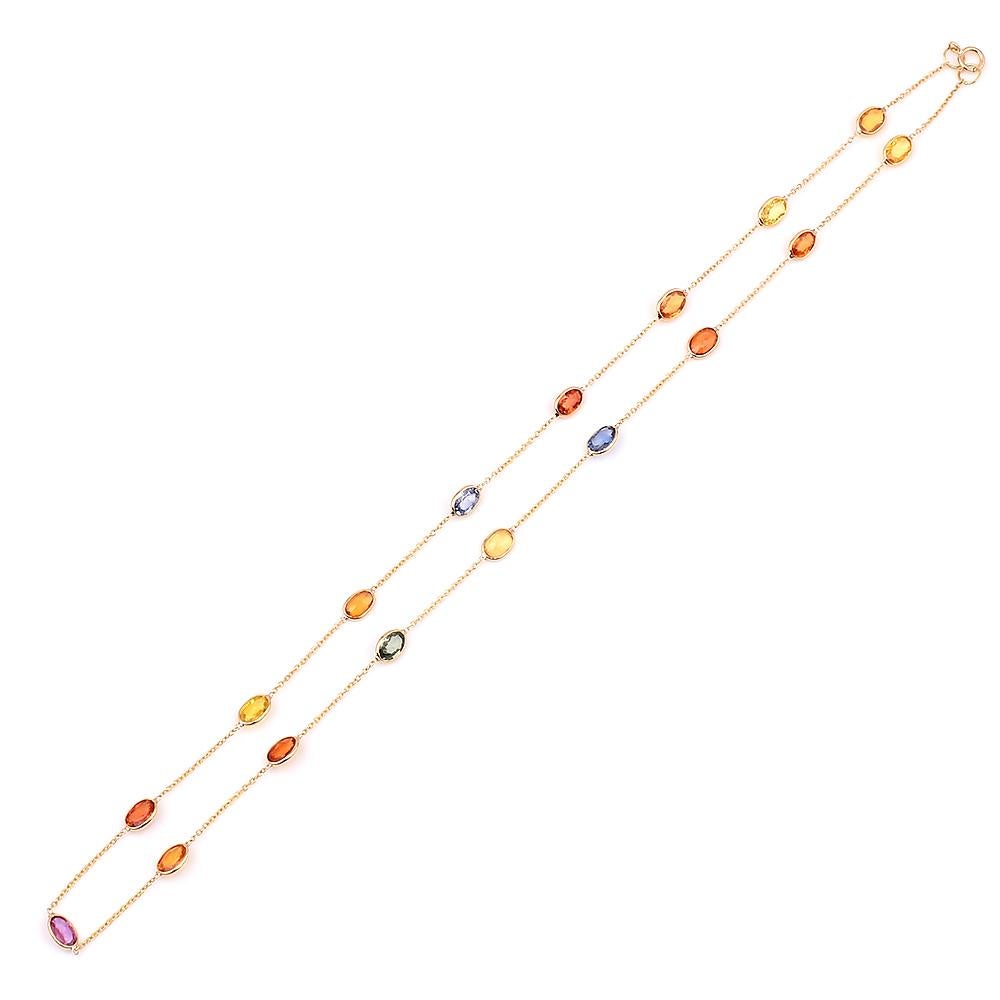 A 4 x 6 Oval Multi-Sapphire Bezel-Set Necklace, 18 Karat Yellow Gold. 18 inches. The stone weight is 1.73 carats. The total weight of the necklace is 3.72 grams. There are a total of 17 stones in the necklace. 