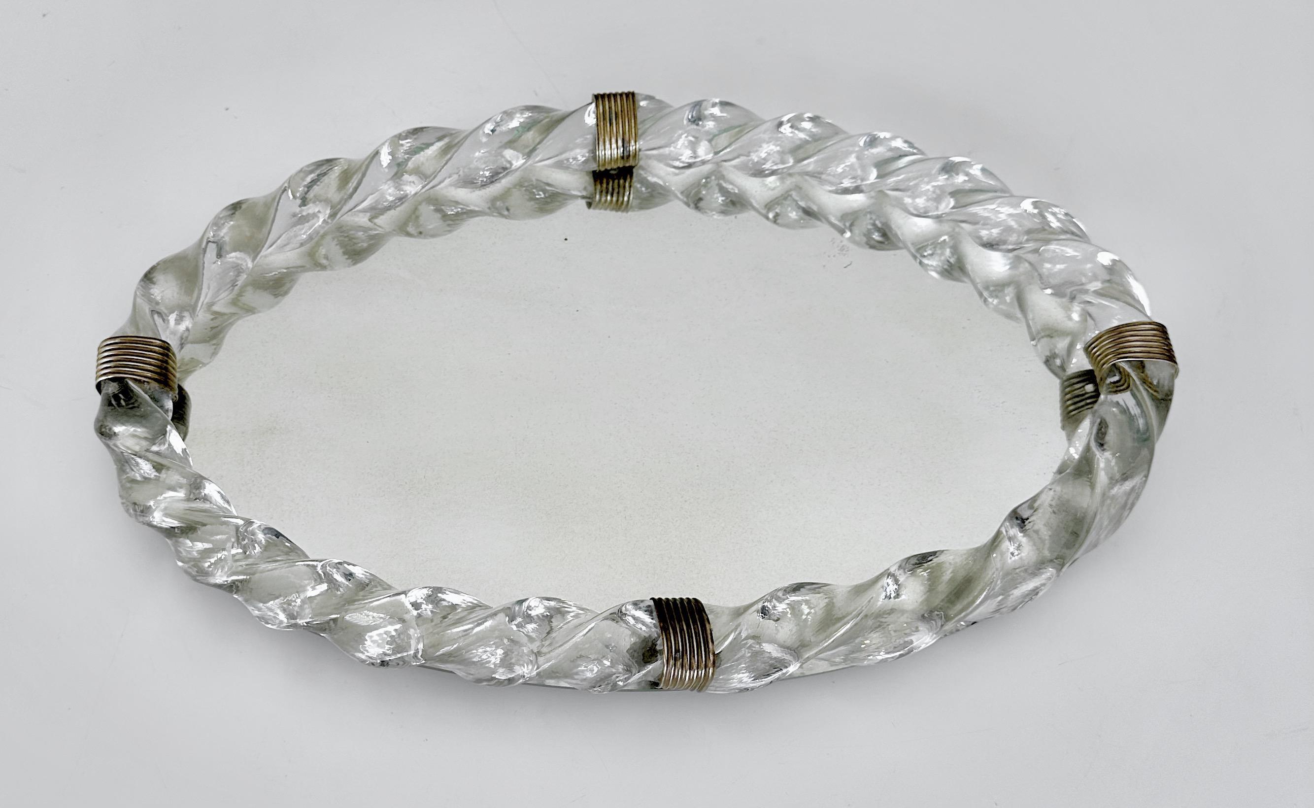 Oval Murano Italian Venetian mirrored and thick twisted glass rope vanity tray with brass fittings.