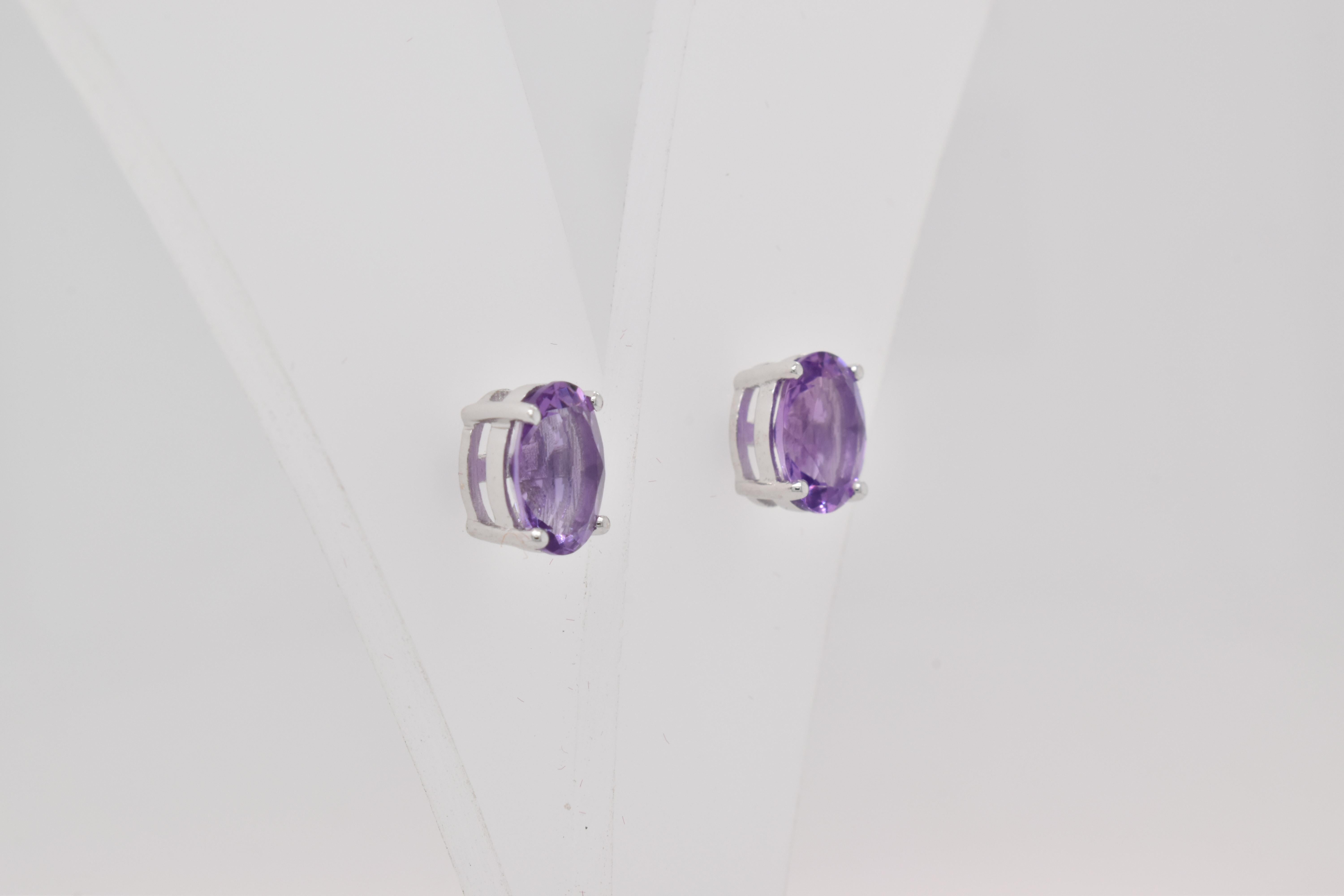 Oval Shape Amethyst Gemstone beautifully crafted in a Earrings. A fiery Violet Color February Birthstone. For a special occasion like Engagement or Proposal or may be as a gift for a special person.

Primary Stone Size - 8x6mm