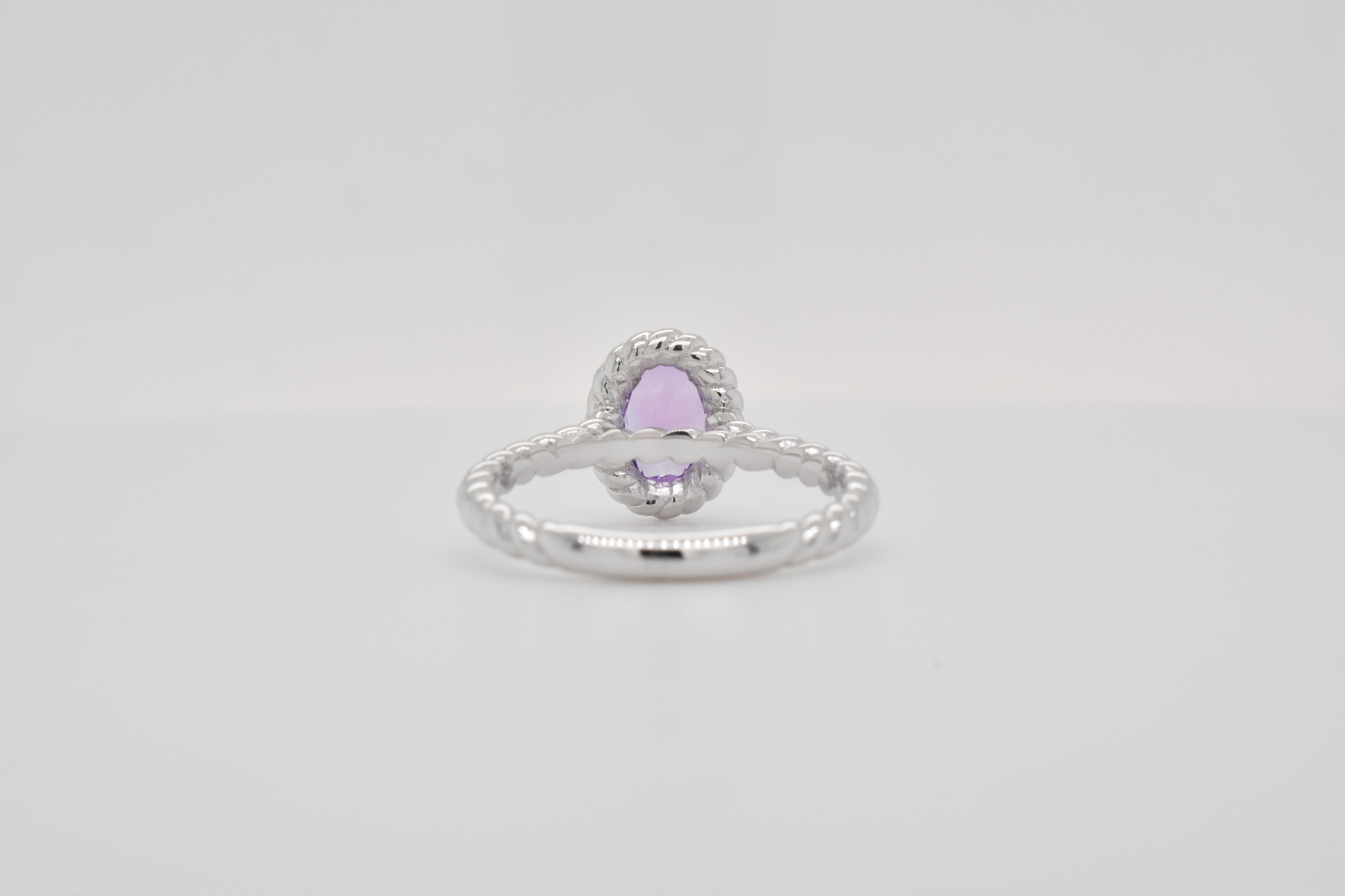 Oval Shape Amethyst Gemstone  beautifully crafted  in a Ring. A fiery Violet Color February Birthstone. For a special occasion like Engagement or Proposal or may be as a gift for a special person.

Primary Stone Size - 7x5 mm
