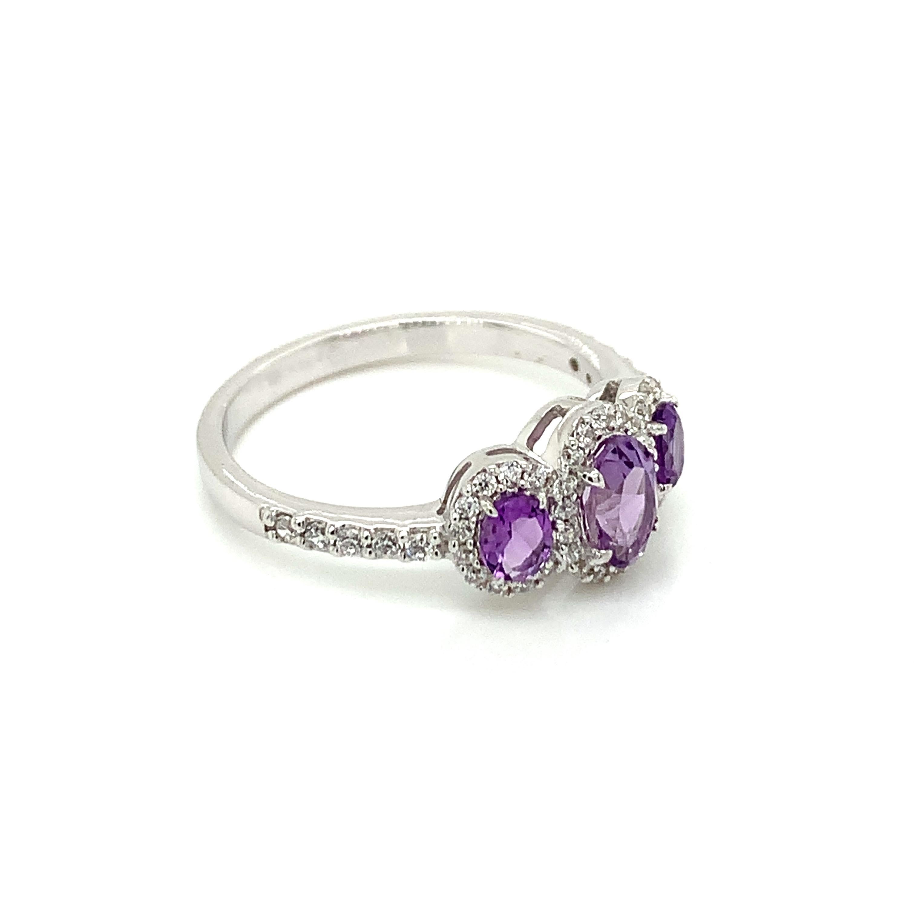 Oval Shape Amethyst Gemstone beautifully crafted with CZ in a Ring. A fiery Violet Color February Birthstone. For a special occasion like Engagement or Proposal or may be as a gift for a special person.

Primary Stone Size - 6x4 & 4x3 mm