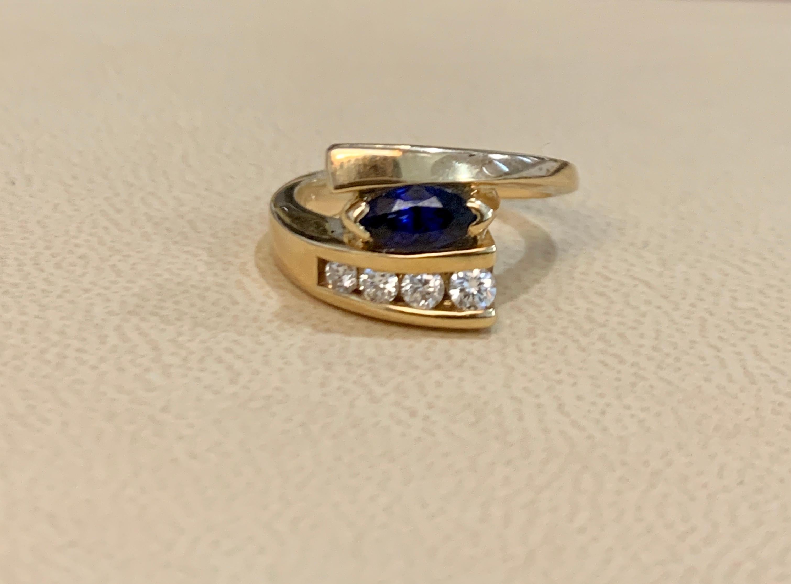 Oval Natural Blue Sapphire and Diamond Engagement Ring in 14 Karat Yellow Gold In Excellent Condition In New York, NY