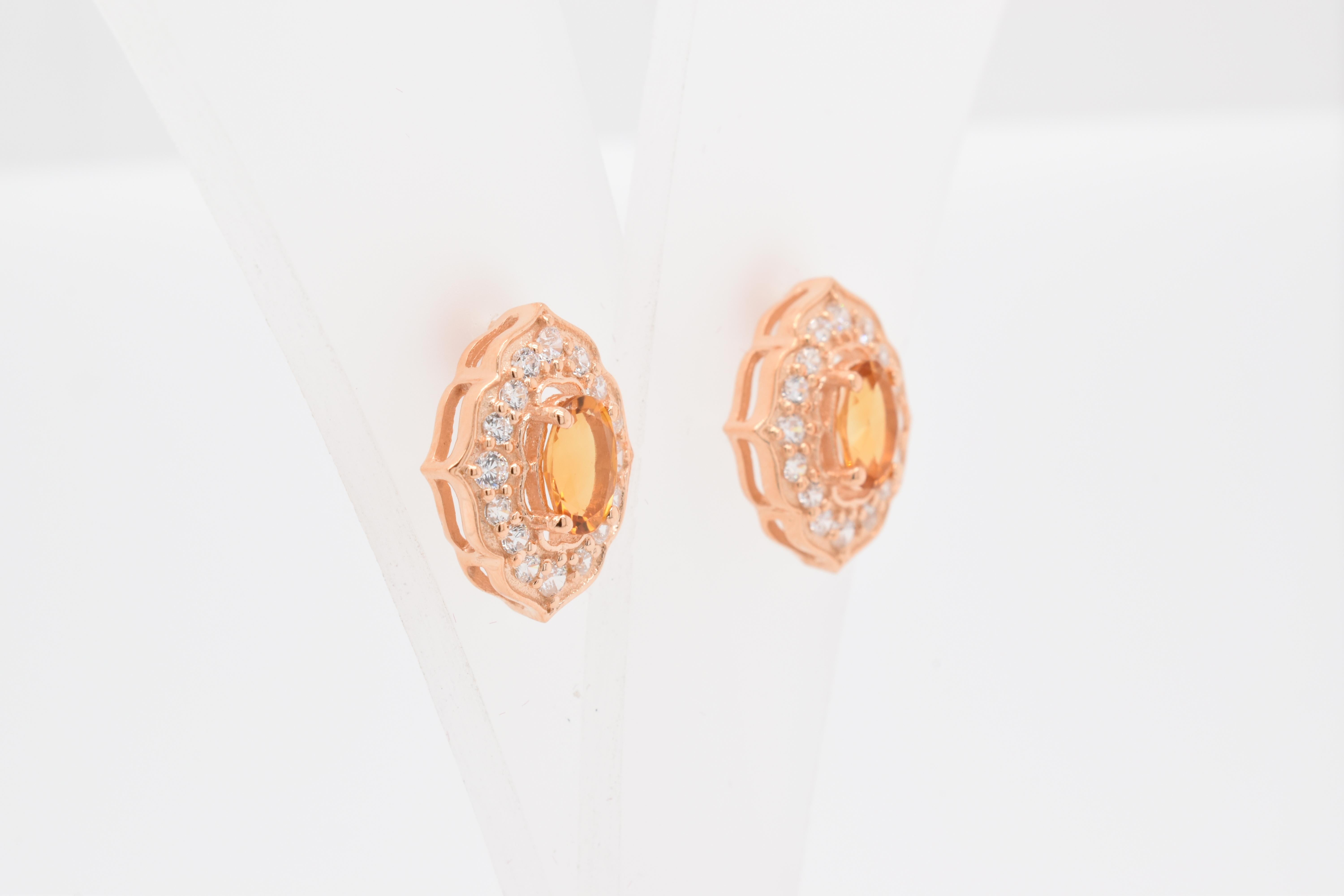 Oval Shape Citrine Gemstone And CZ beautifully crafted  in a Earrings. A fiery Yellow Color November Birthstone. For a special occasion like Engagement or Proposal or may be as a gift for a special person.

Primary Stone Size - 6x4 mm