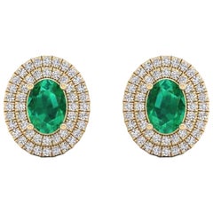 Oval Natural Emerald 
Double Halo Diamond Stud Post Earrings 14 Kt Yellow Gold