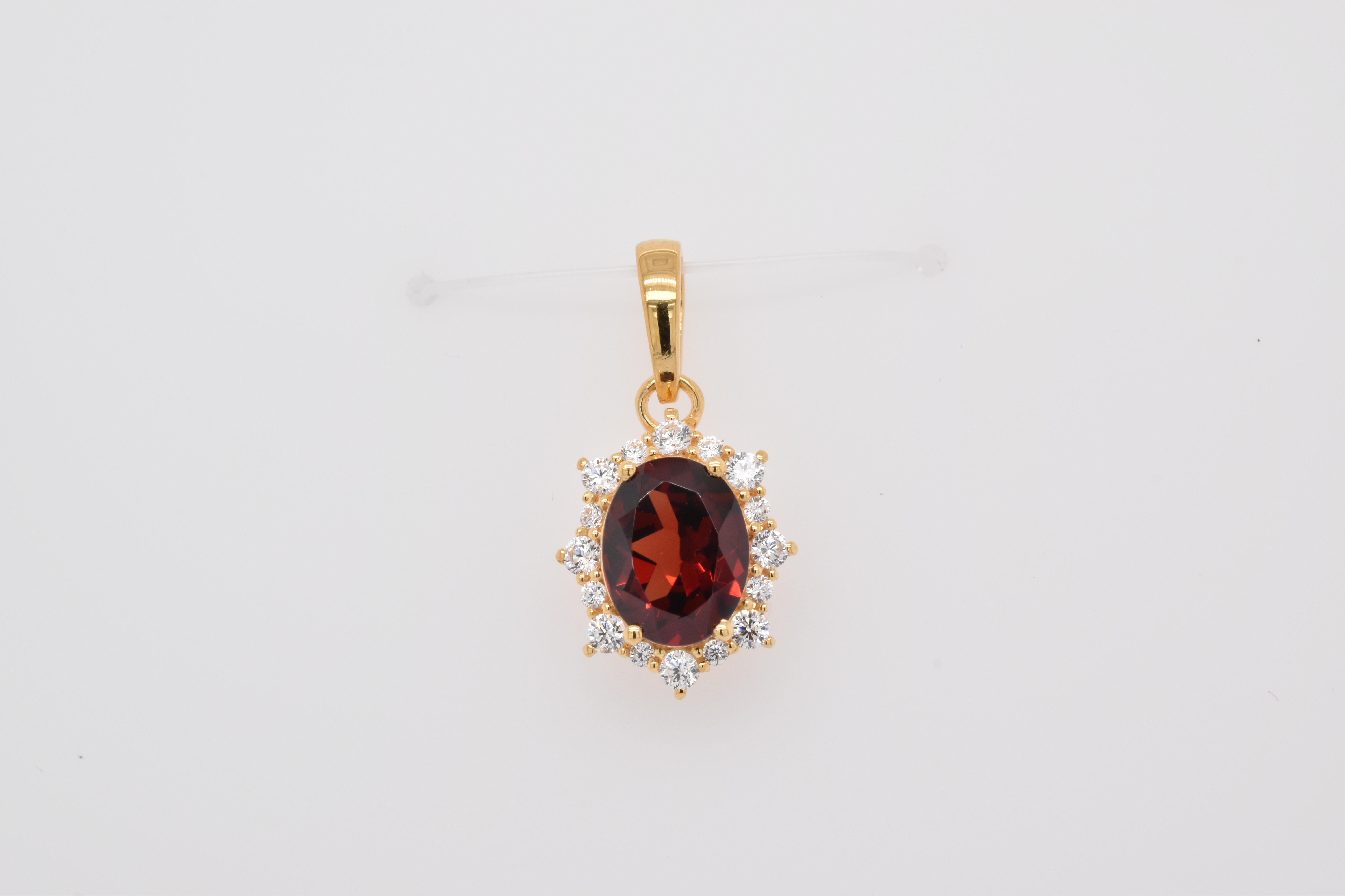 Oval Shape Garnet Gemstone And CZ beautifully crafted  in a Pendant. A fiery Red Color January Birthstone. For a special occasion like Engagement or Proposal or may be as a gift for a special person.

Primary Stone Size - 9x7 mm