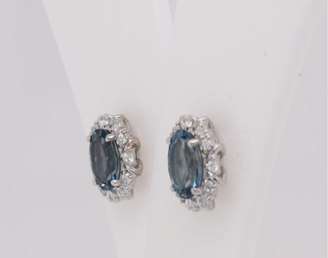 Oval Cut Oval  Natural London Blue Topaz And CZ Rhodium Over Sterling Silver Earrings For Sale