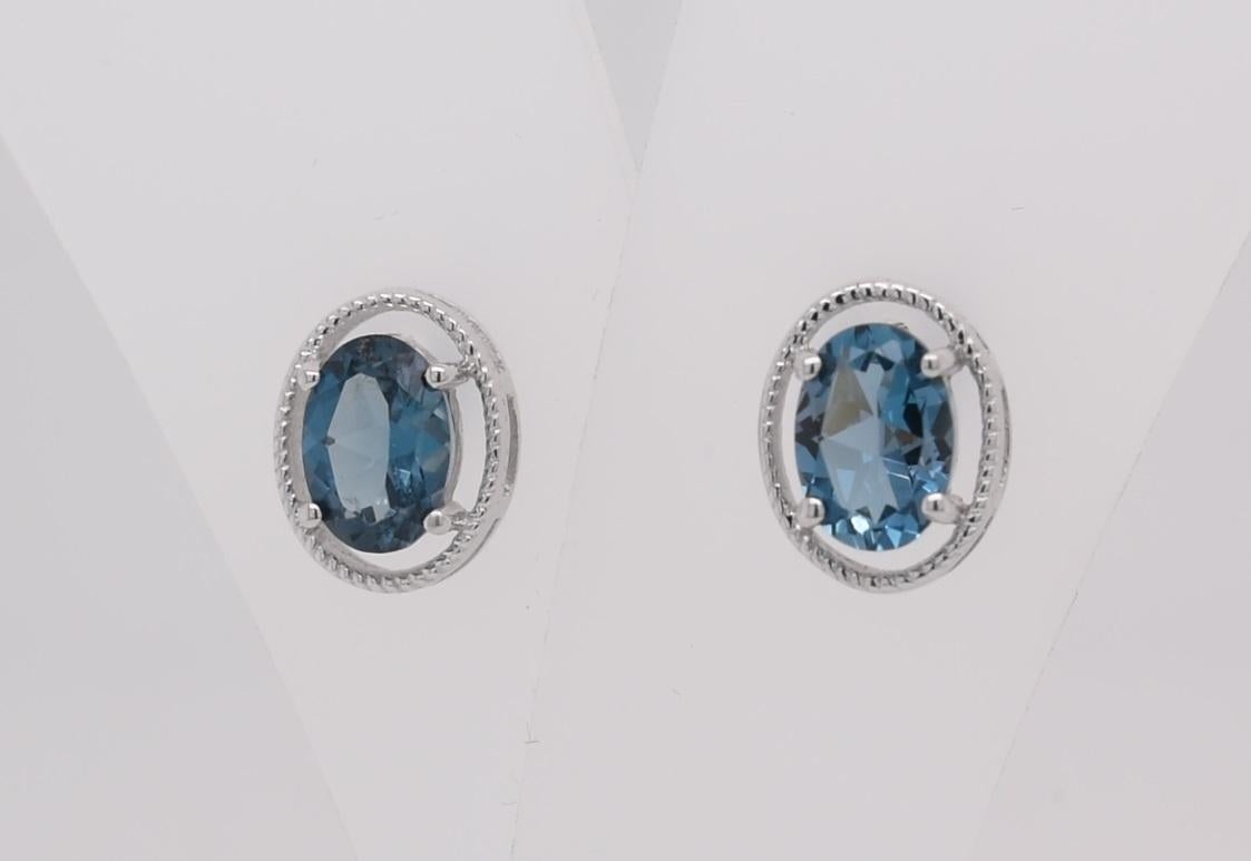 Oval Cut Oval  Natural London Blue Topaz  Rhodium Over Sterling Silver Earrings For Sale