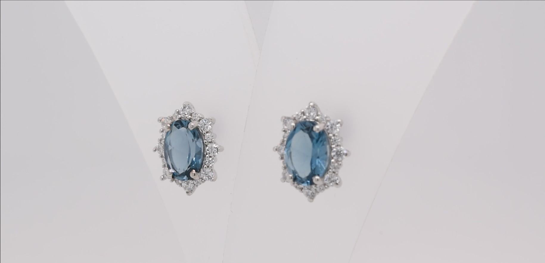 Oval Cut Oval Natural London Blue Topaz And CZ Rhodium over Sterling Silver Earrings For Sale
