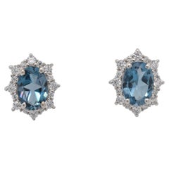 Oval Natural London Blue Topaz And CZ Rhodium over Sterling Silver Earrings