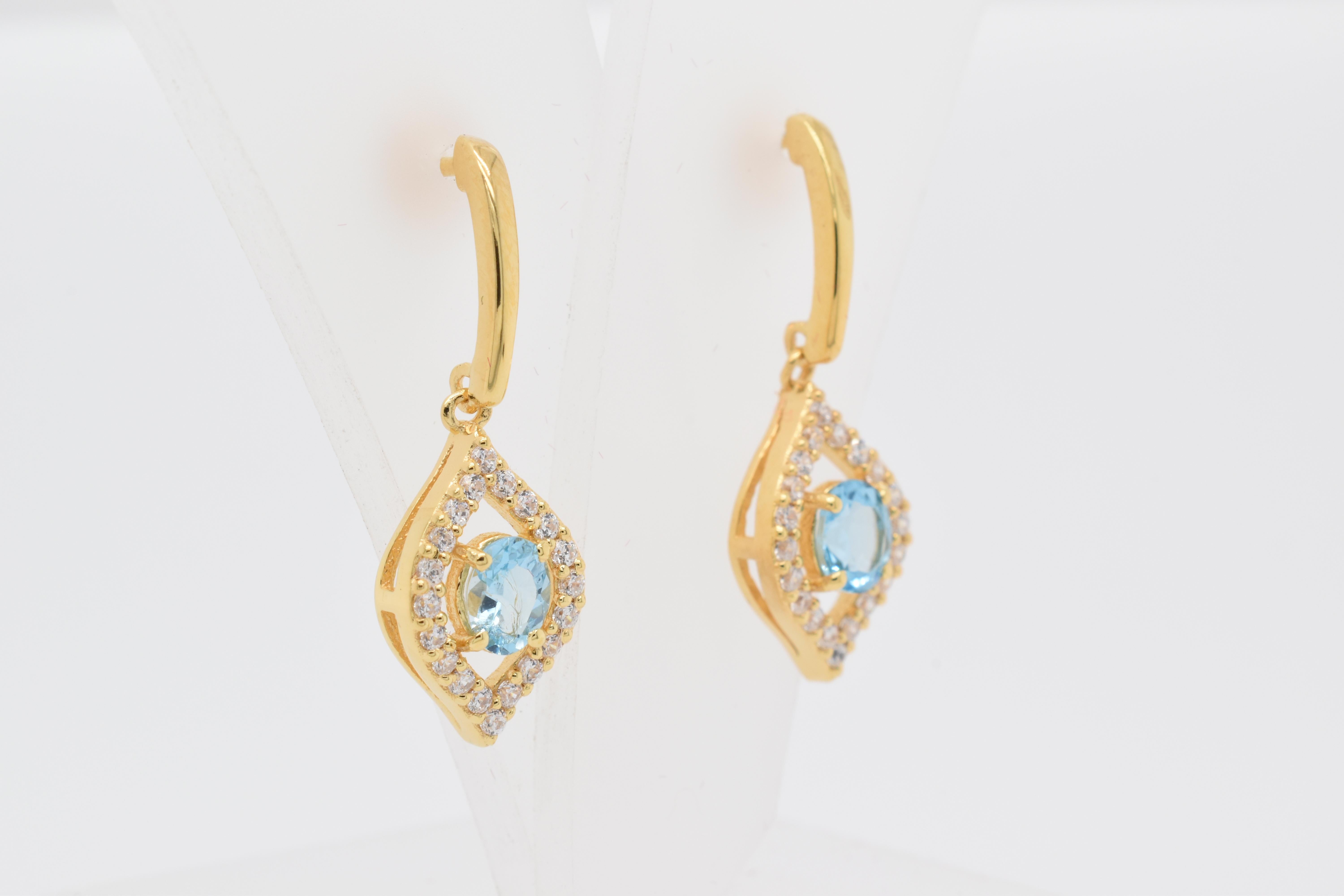 Oval Cut Oval  Natural Sky Blue Topaz And CZ Yellow Gold Over Sterling Silver Earrings For Sale