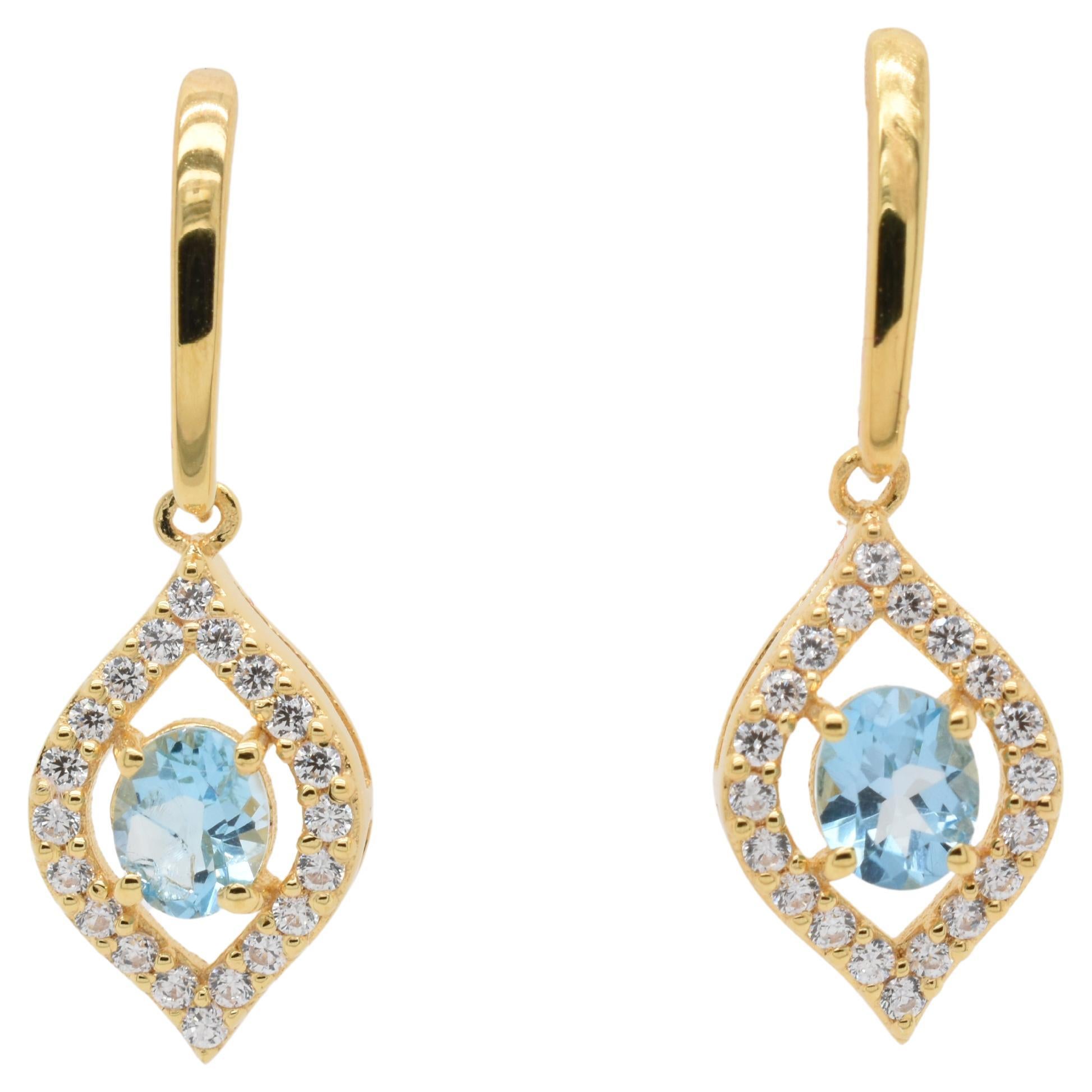 Oval  Natural Sky Blue Topaz And CZ Yellow Gold Over Sterling Silver Earrings