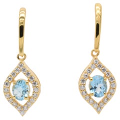 Oval  Natural Sky Blue Topaz And CZ Yellow Gold Over Sterling Silver Earrings