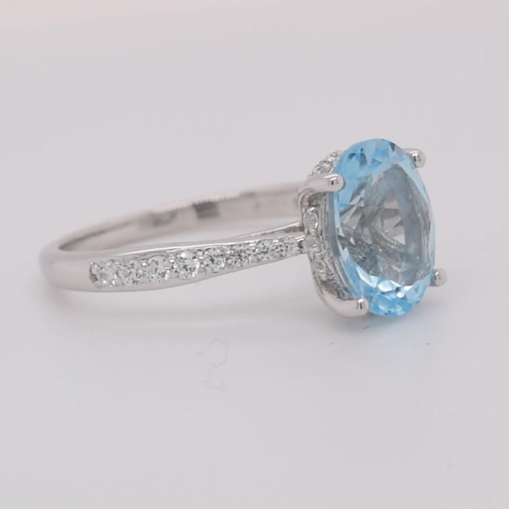 Oval Natural Sky Blue Topaz with CZ, Rhodium Over Sterling Silver Ring In New Condition For Sale In Fort Lee, NJ
