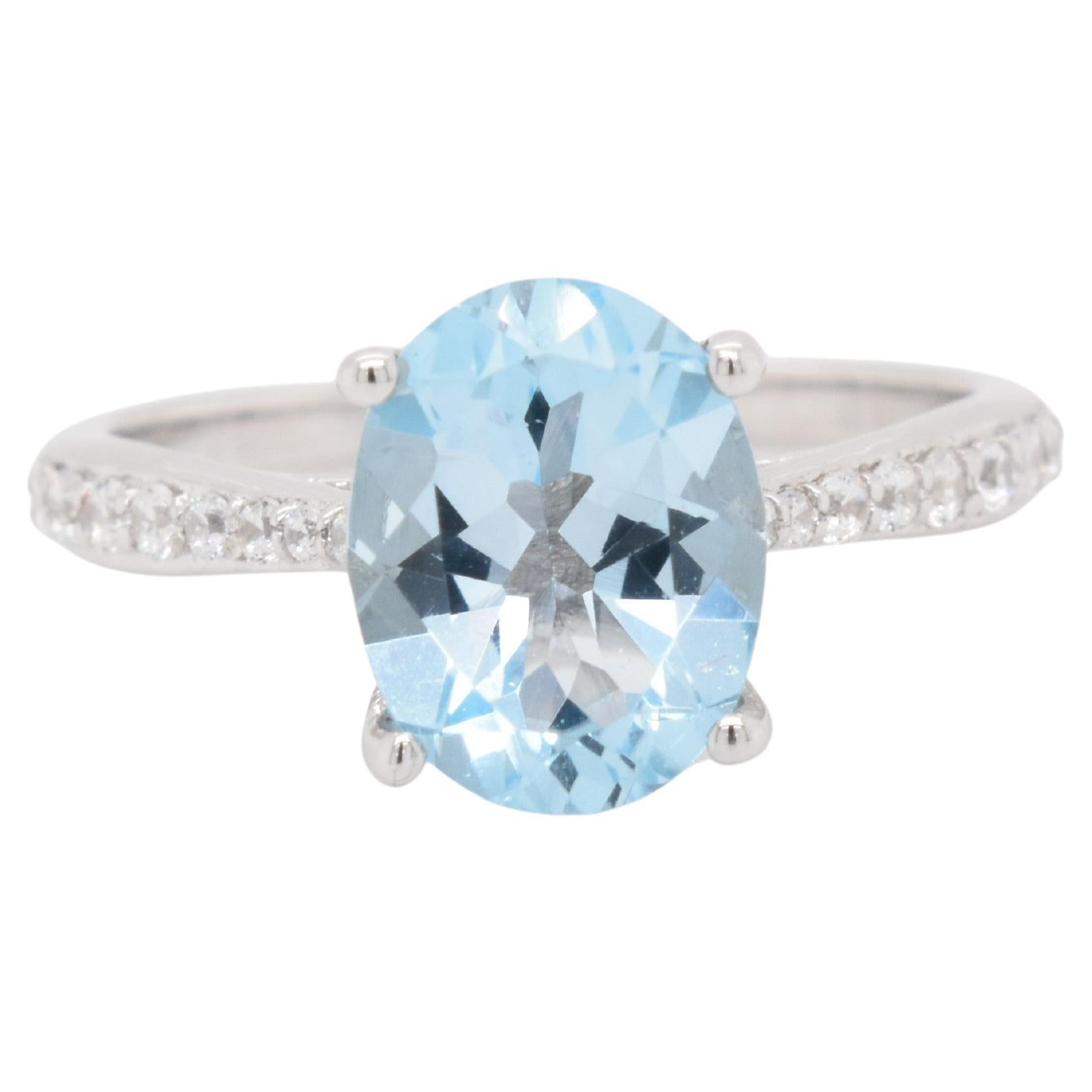 Oval Natural Sky Blue Topaz with CZ, Rhodium Over Sterling Silver Ring For Sale