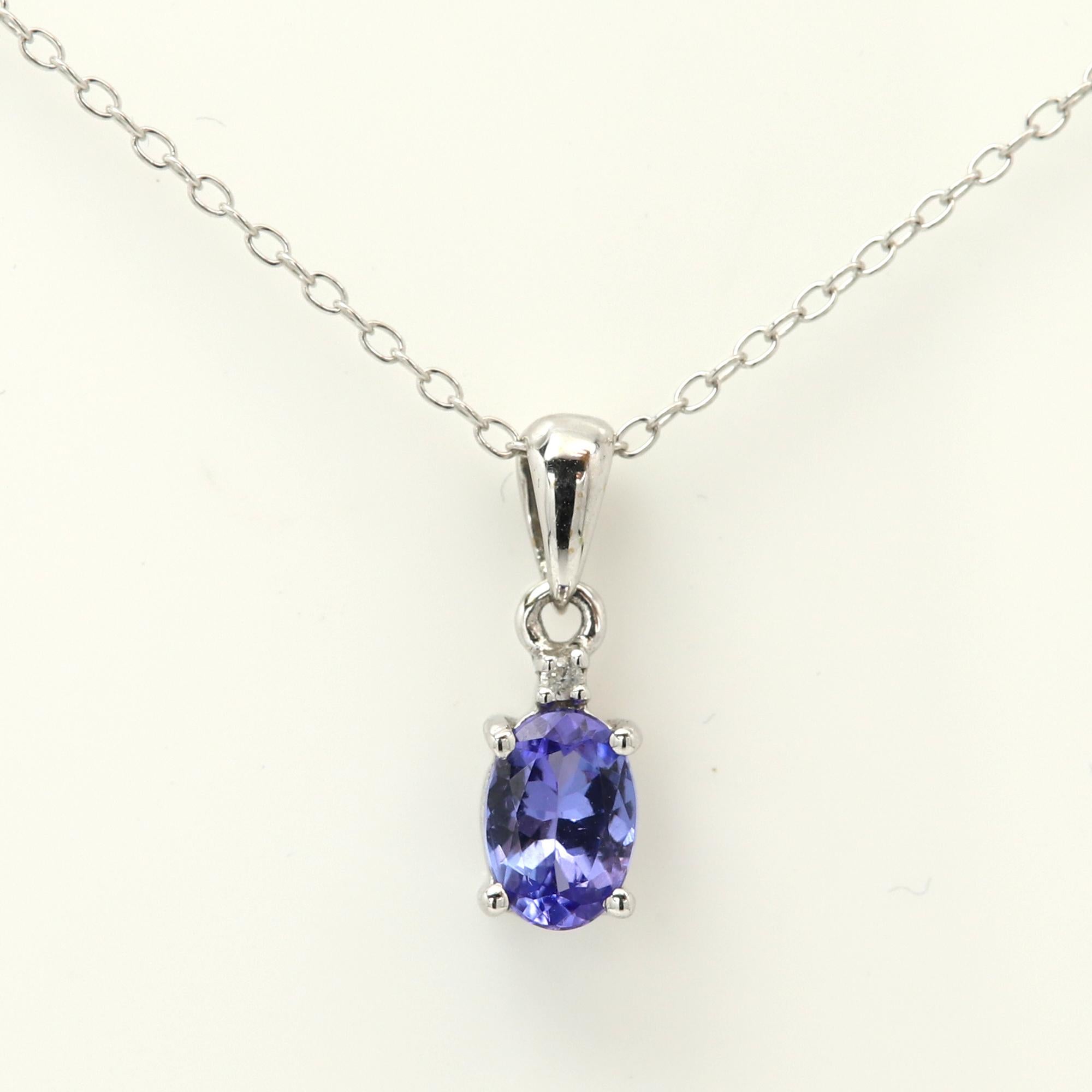 Oval Tanzanite Purple Gemstone Pendant
Natural Tanzanite 
14k White Gold 0.80 grams without the chain.
Tanzanite size & weight approx 0.82 carat (7 x 5 mm)
Basic standard cable link chain 14k white gold 16' Inch Length
Gift Box Included
