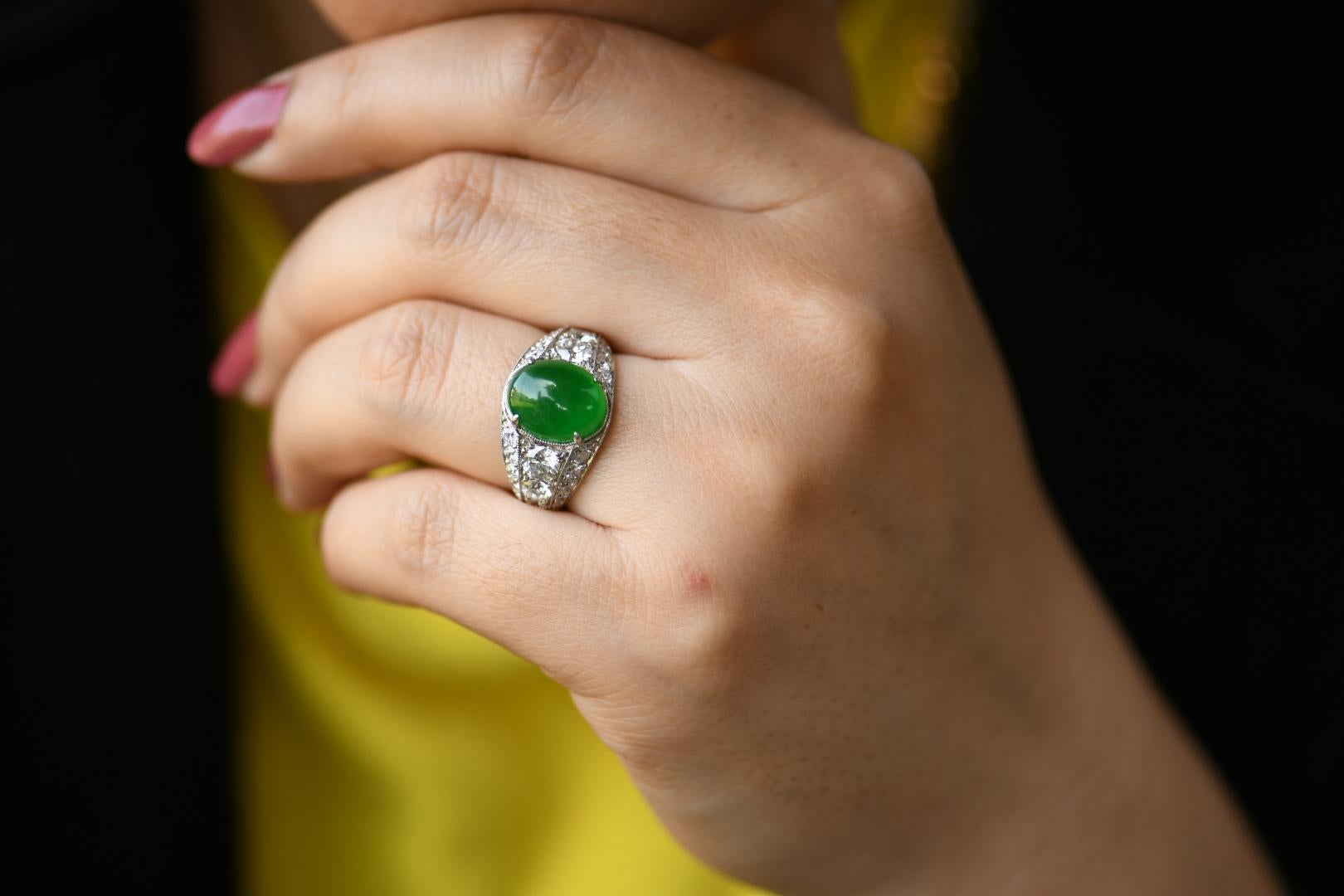 Jadeite weighing: 5.00 ct
Estimated Total Diamonds: 2.05ct  GH color VS clarity 
Ring size: USA size 6
Weight: 9.12g

This is a truly stunning ring. Everything, the colours, the stone, the design and workmanship are all absolutely spot on. The focus