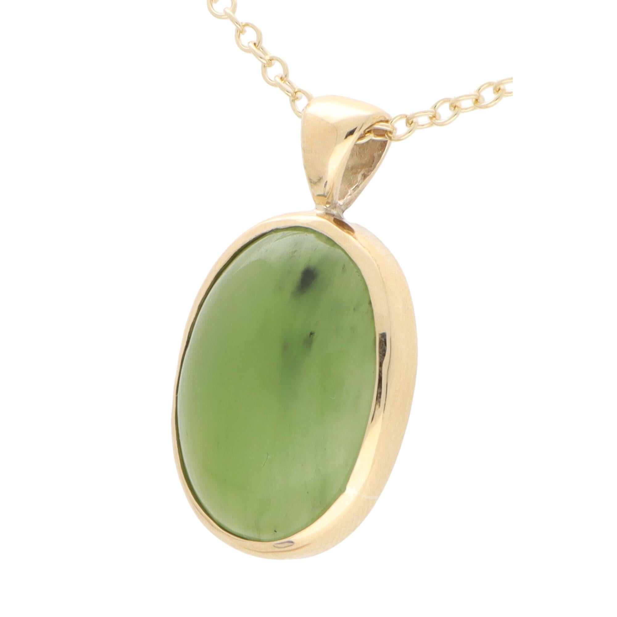 A beautiful cabochon nephrite pendant set in 9k yellow gold.

The pendant solely features a vibrant green nephrite with is simply bezel set securely in 9k yellow gold. The pendant hangs from a matching 9k yellow gold trace chain. The chain measures