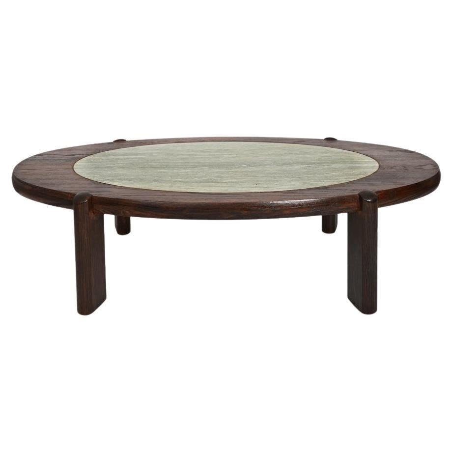 Oval oak and granite coffee table, 1960s. For Sale