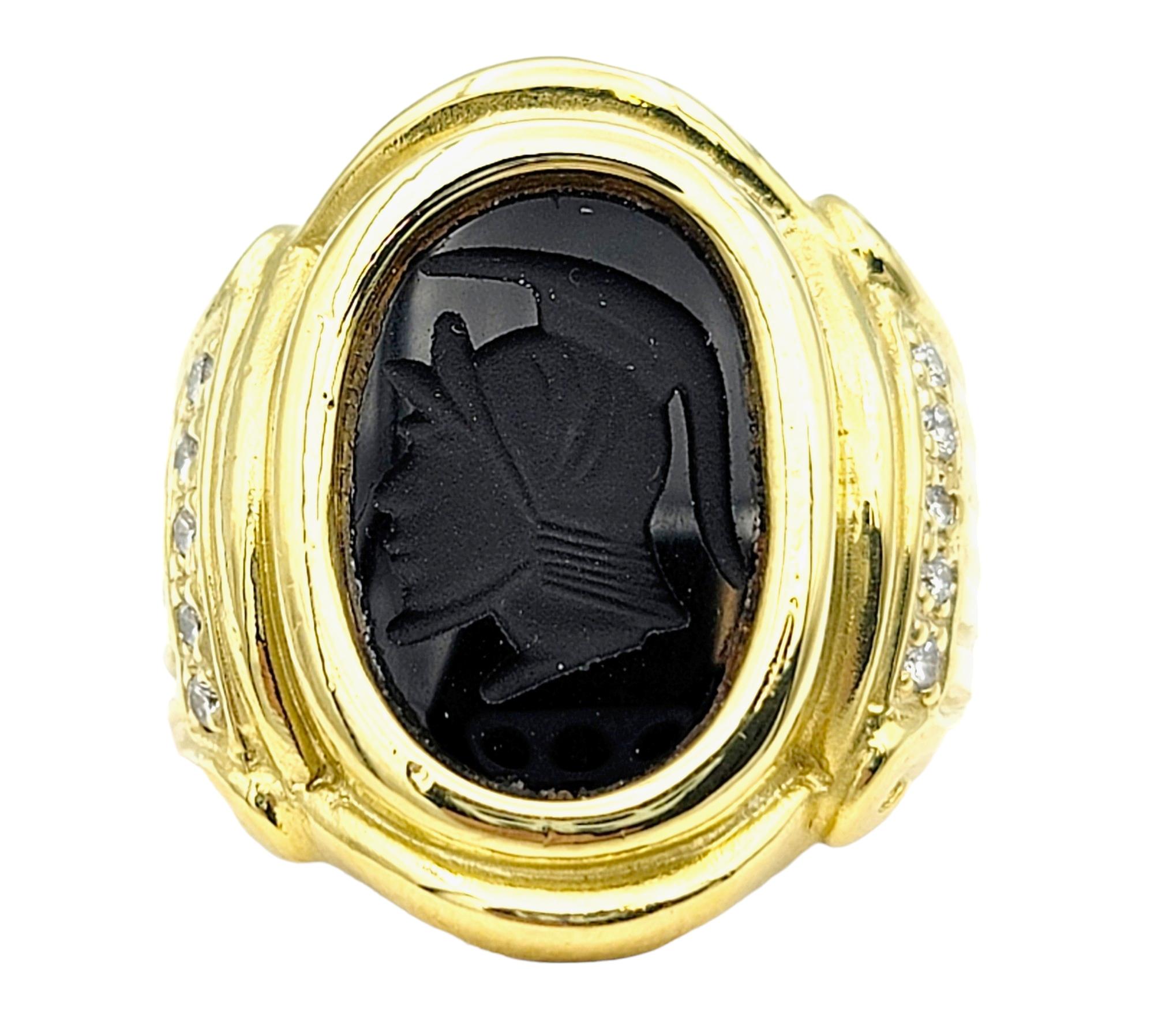 Ring size: 6.25

We absolutely love this unique unisex ring -  a timeless piece that effortlessly blends history and luxury. Crafted in lustrous 18 karat yellow gold, this captivating ring showcases a meticulously carved onyx intaglio featuring a