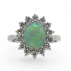 Oval Opal and Diamond Claw Set Cluster Ring 18 Karat White Gold