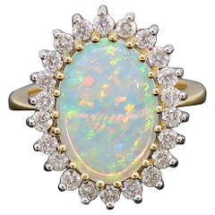 Oval Opal and Diamond Claw Set Cluster Ring 18 Karat Yellow and White Gold Oval Opal and Diamond Claw Set Cluster Ring 18 Karat Yellow and White Gold