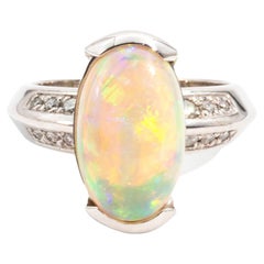 Oval Opal Cabochon and Round Brilliant Diamond Vintage Ring in 18ct White Gold