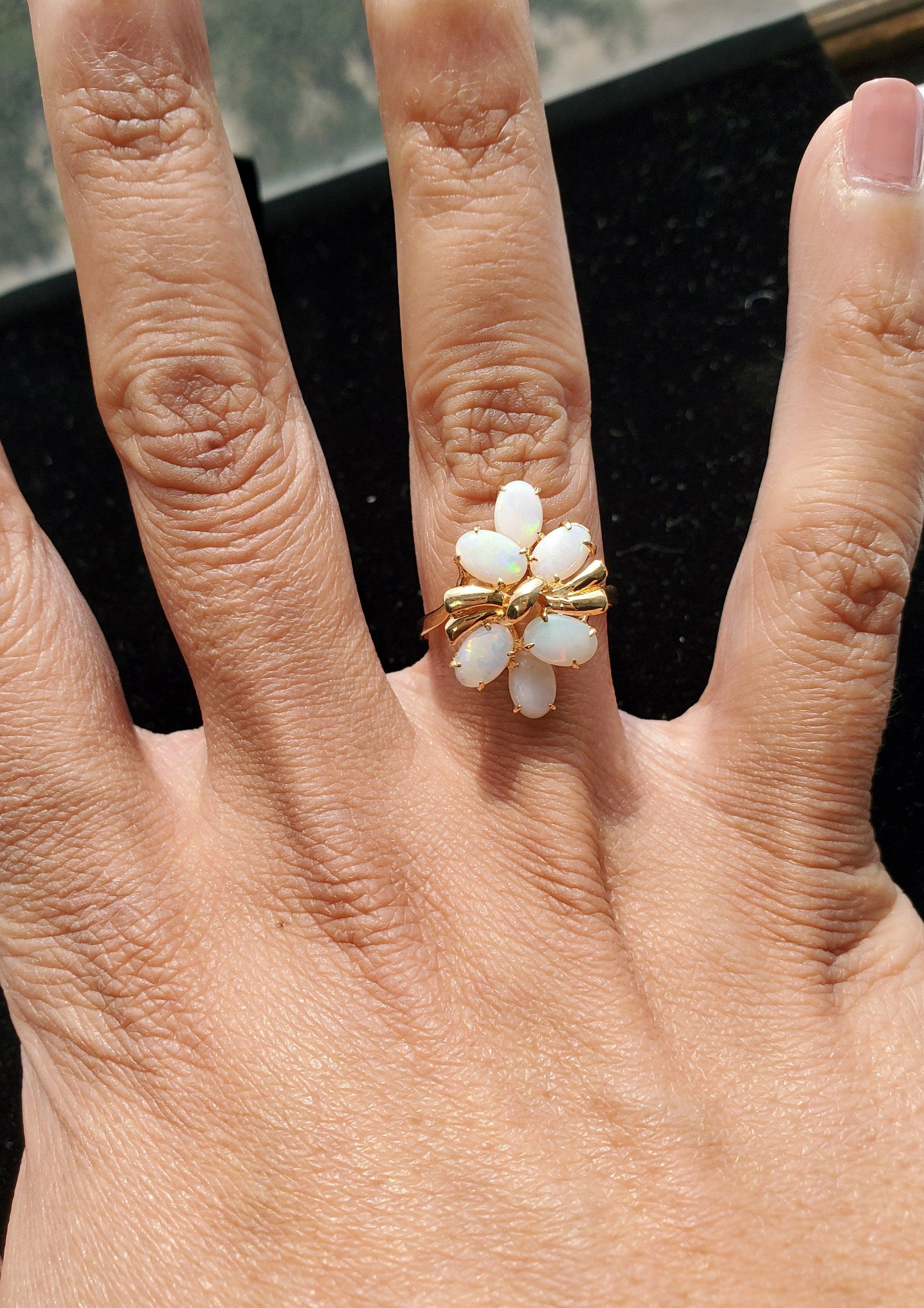 ♥ Product Summary ♥

Main Stone: Opal (Translucent) Australian Opal
Band Material: 14k Yellow Gold
Dimensions: 20mm x 13mm
Stone Cut: Oval 
Weight: 2 grams

**Due to the uniqueness of the opal stone, there are flashes of iridescent colors when it is