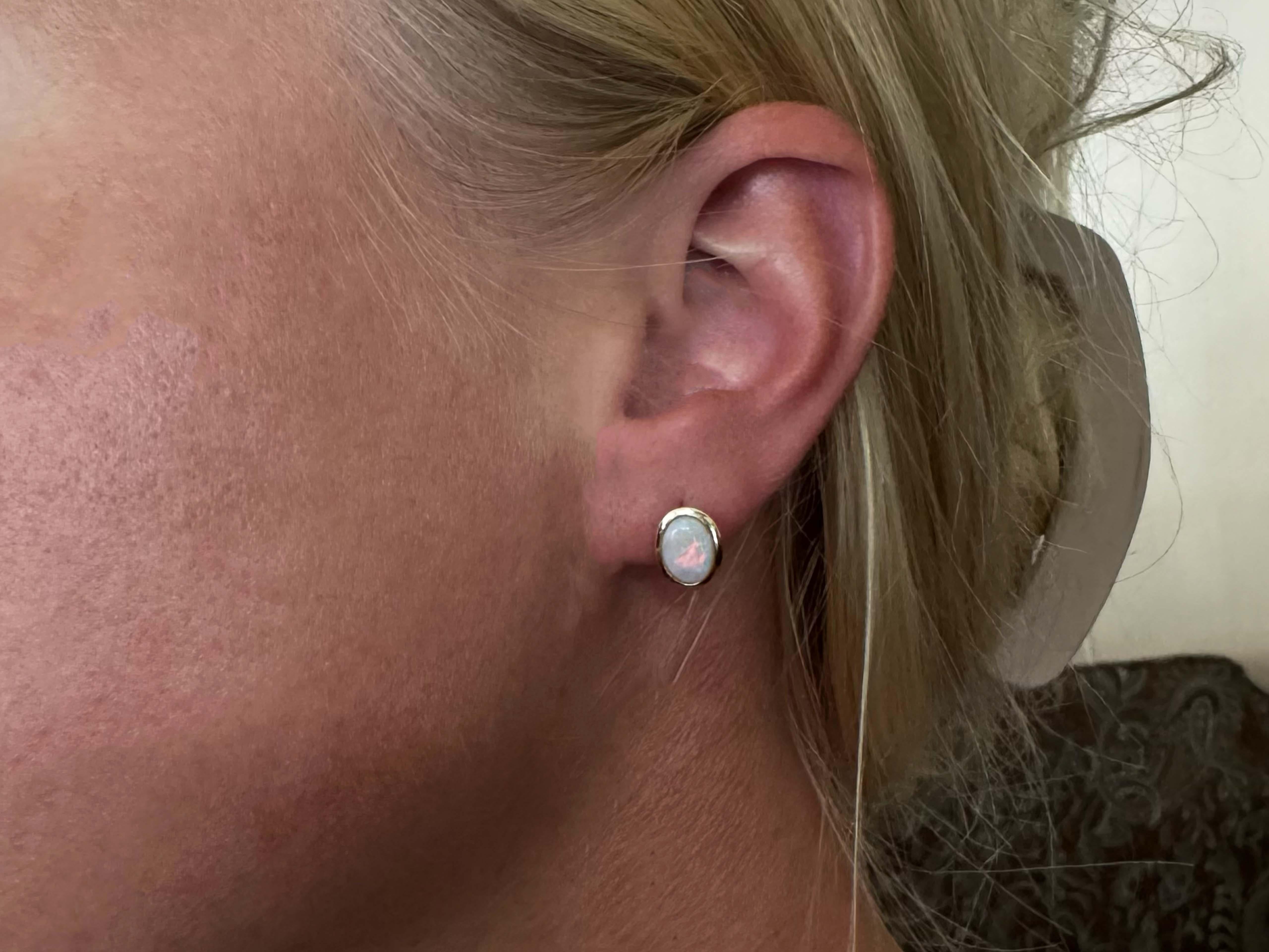 Earrings Specifications:

Metal: 14K Yellow Gold

Total Weight: 1.1 Grams
​
​Gemstone: Opal
Opal Measurements: 8.3 mm x 6.7 mm x 2.4 mm 
Earring Diameter: 10.5 mm x 7.5 mm
​
​Condition: Excellent, Preowned