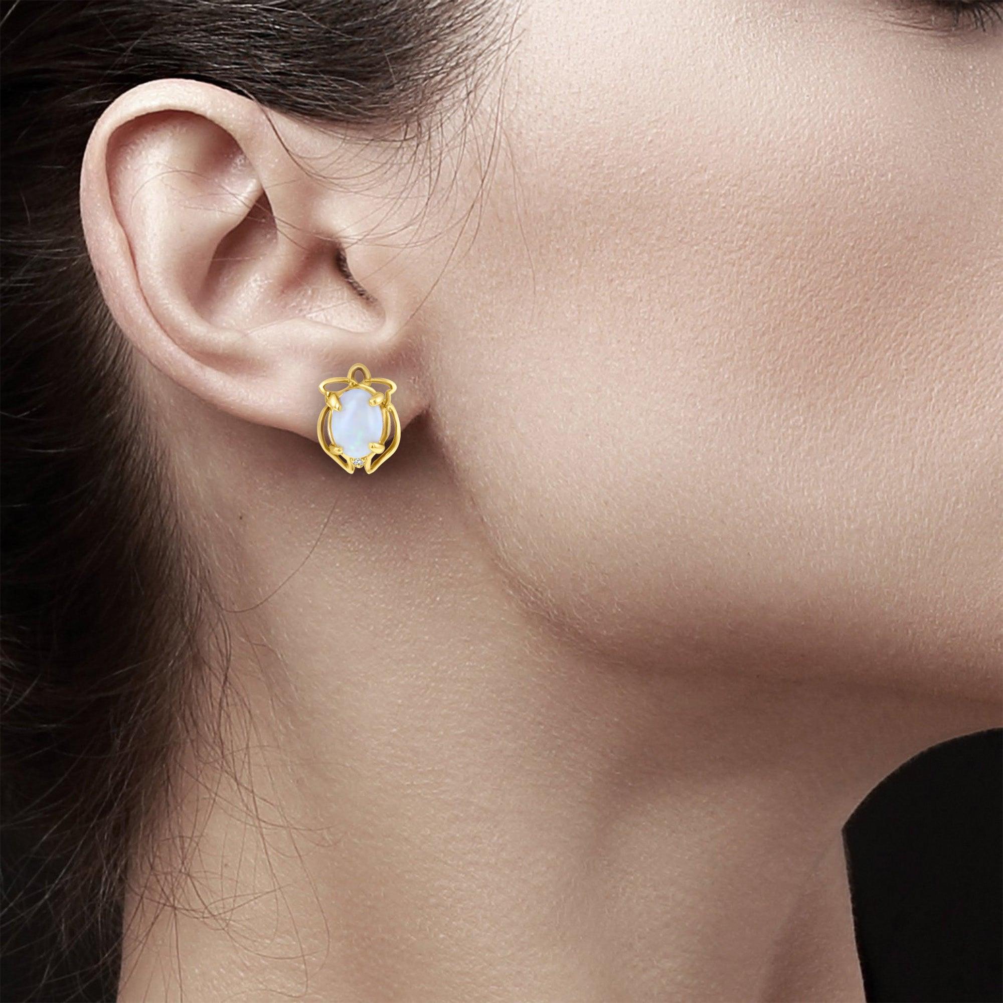 ♥ Sommaire du produit ♥

Pierre principale : Opale australienne 
Métal : Or jaune 14k 
Taille de la pierre : Ovale
Fermeture : Papillon 

**En raison du caractère unique de la pierre d'opale, des éclats de couleurs irisées apparaissent lorsqu'elle