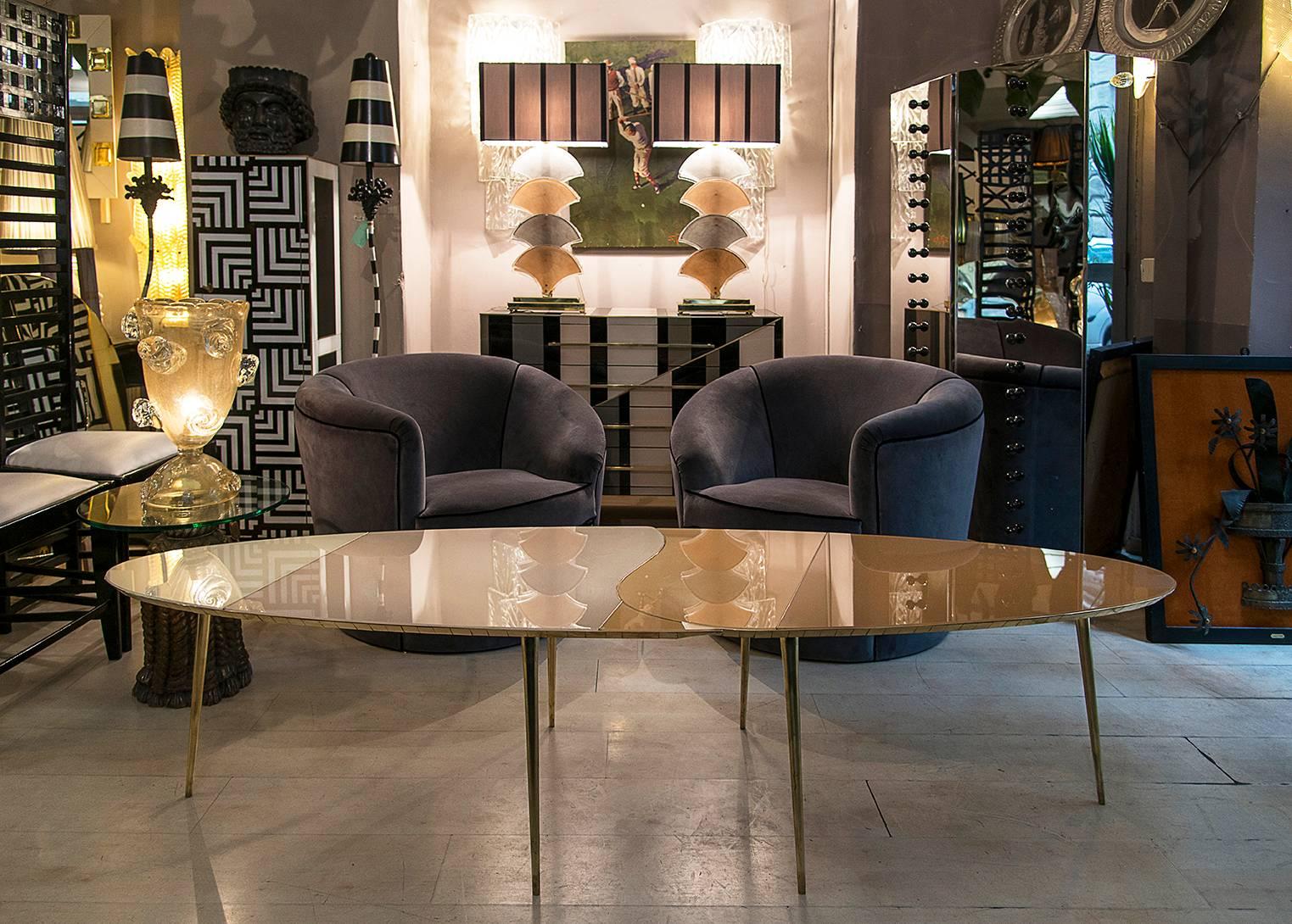 Oval opalines glass Italian coffee table, openable, convertible in two tables, brass legs and fittings.



   
