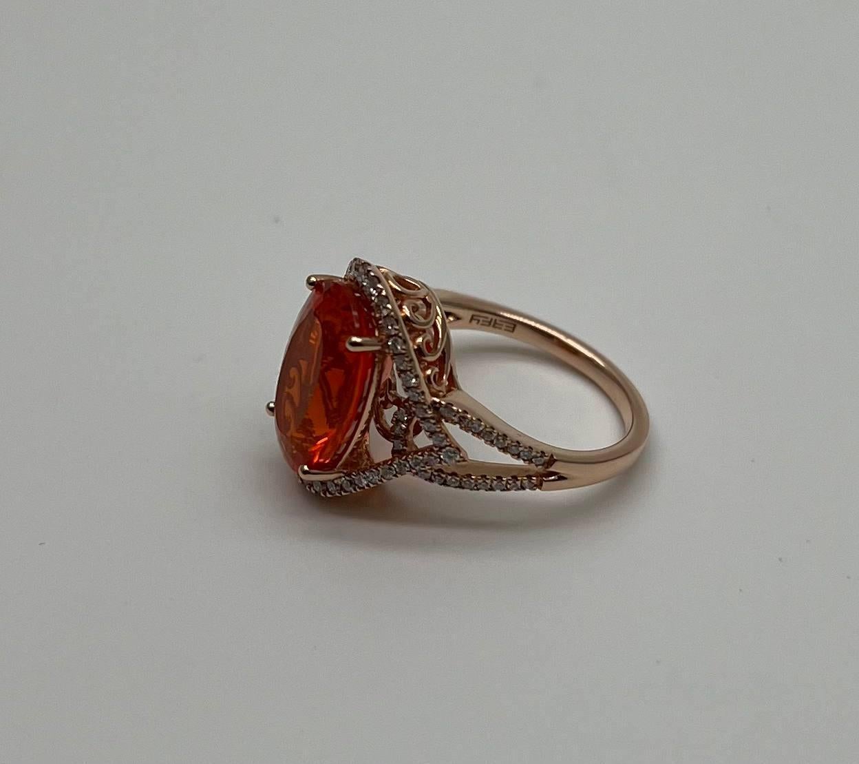 A striking Fire Opal and Diamond Ring, featuring a vibrant oval Fire Opal set in a delicate rose gold band, adorned with shimmering diamonds.
3.52 carats Fire Opal Carats
0.46 carats White Diamonds CTW