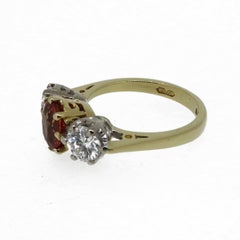Oval Orange Sapphire and Diamond Three-Stone Ring 18 Karat Yellow and White Gold