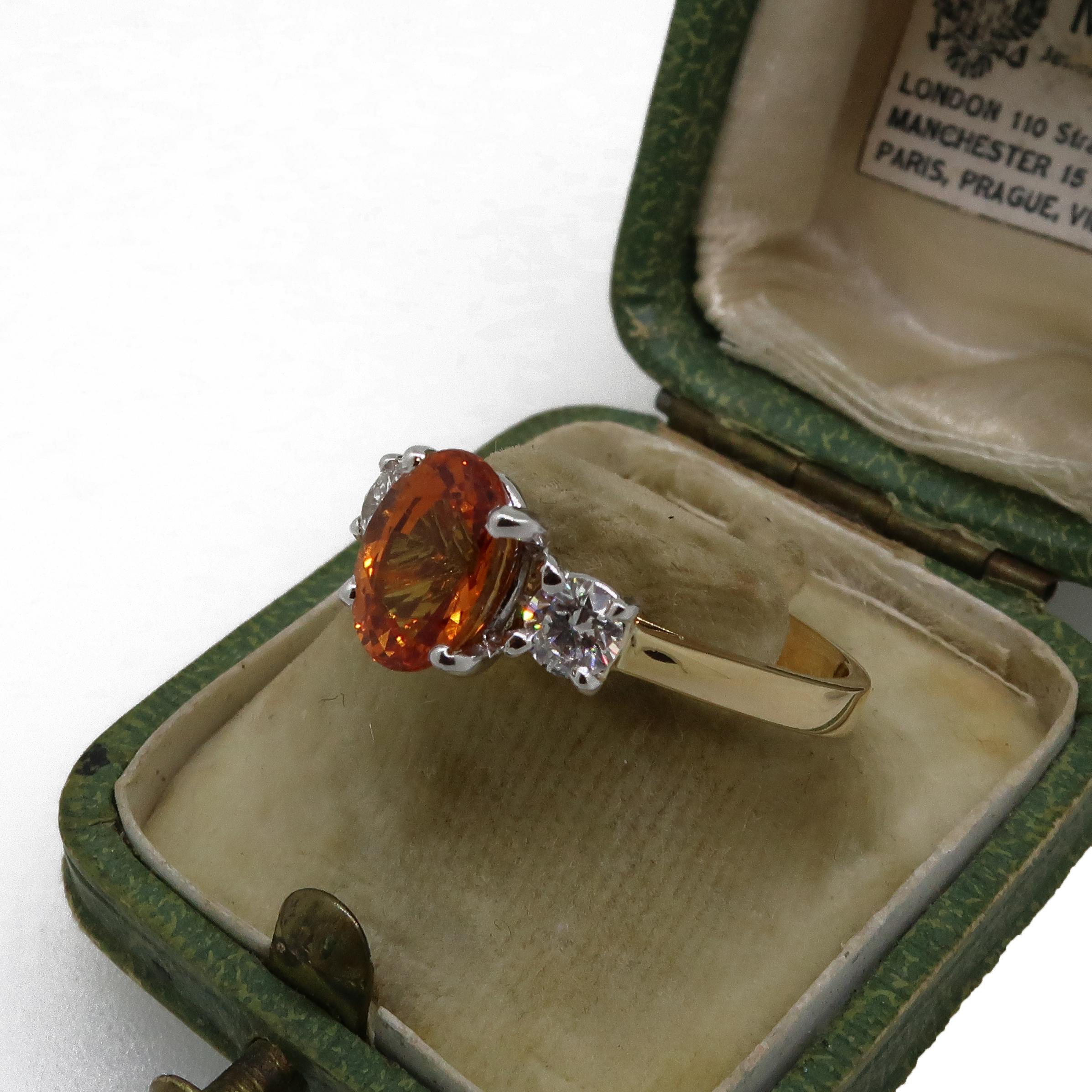 Modern Oval Orange Sapphire and Diamond Three-Stone Ring 18 Karat Yellow and White Gold