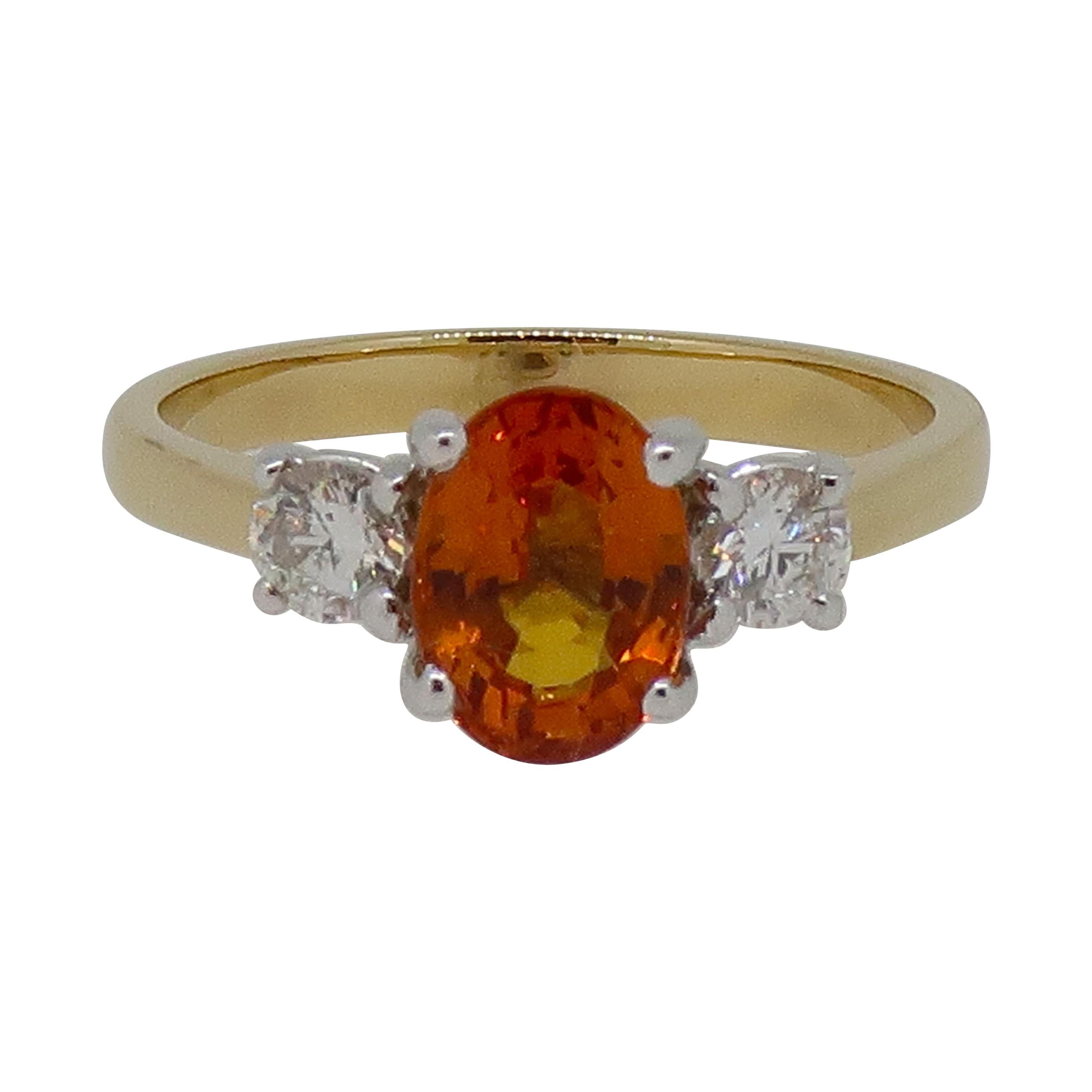 Oval Orange Sapphire and Diamond Three-Stone Ring 18 Karat Yellow and White Gold