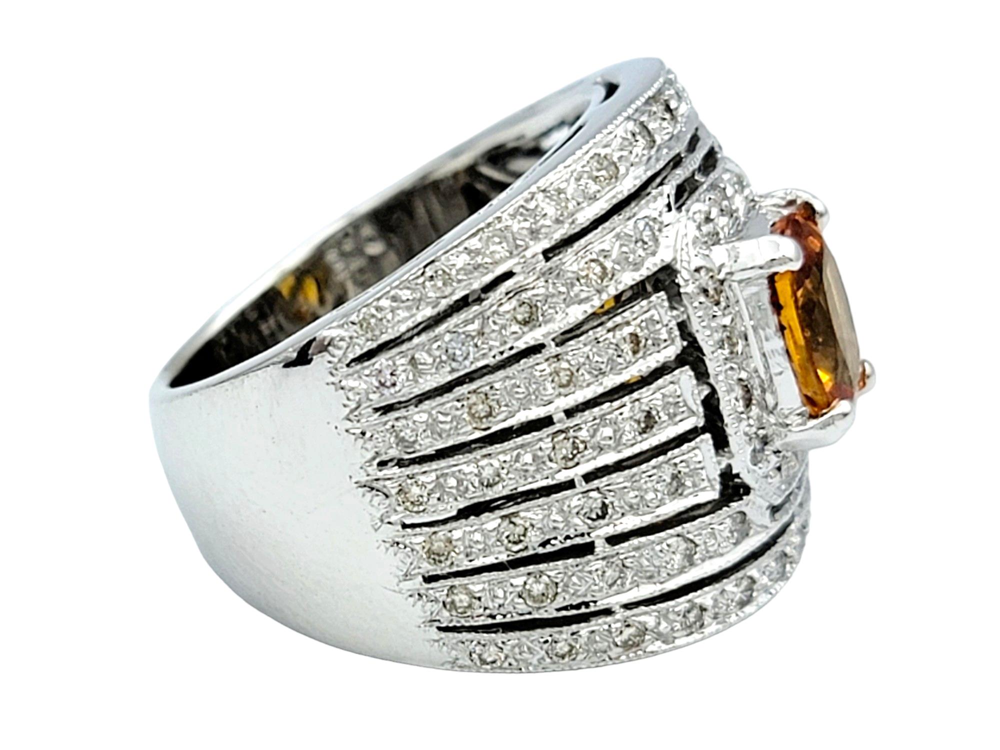 Contemporary Oval Orange Sapphire and Multi-Row Diamond Wide Band Ring in 14 Karat White Gold For Sale