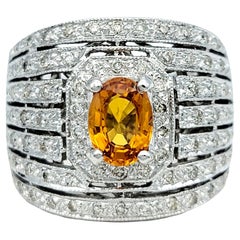 Anillo ancho de zafiro naranja ovalado y diamantes en varias filas, oro blanco de 14 quilates